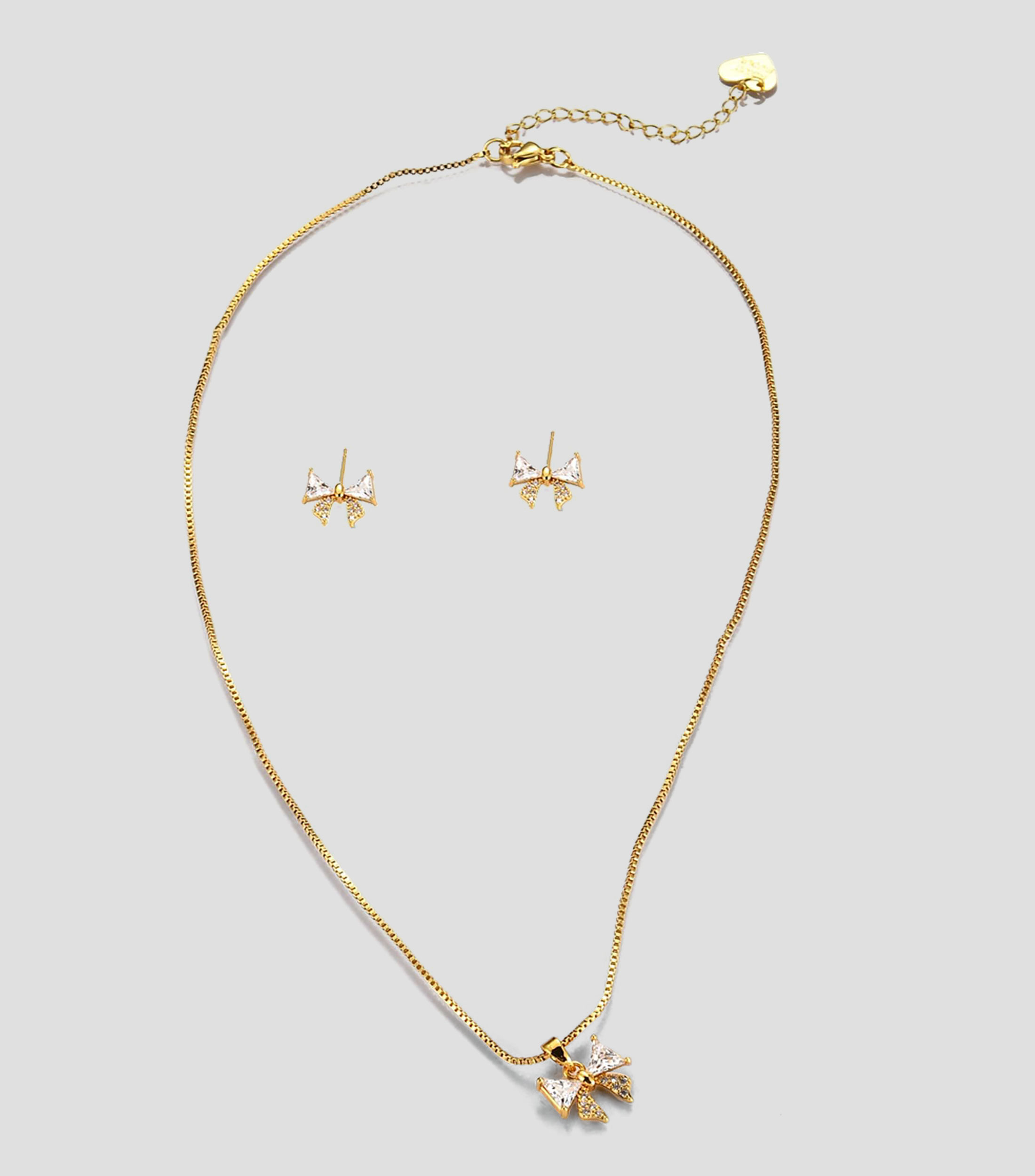 Set de collar y aretes moño con zirconias Mujer