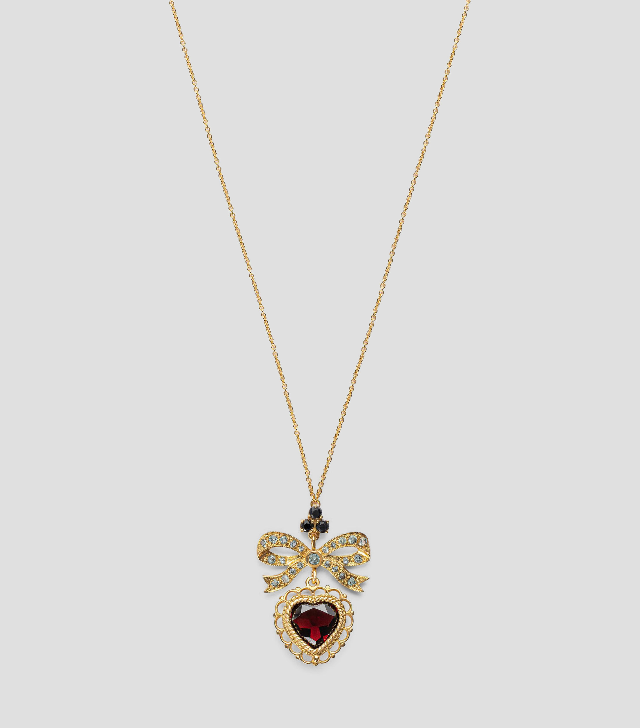 Collar con corazón en Oro de 18 Kilates con moño Devotion Mujer