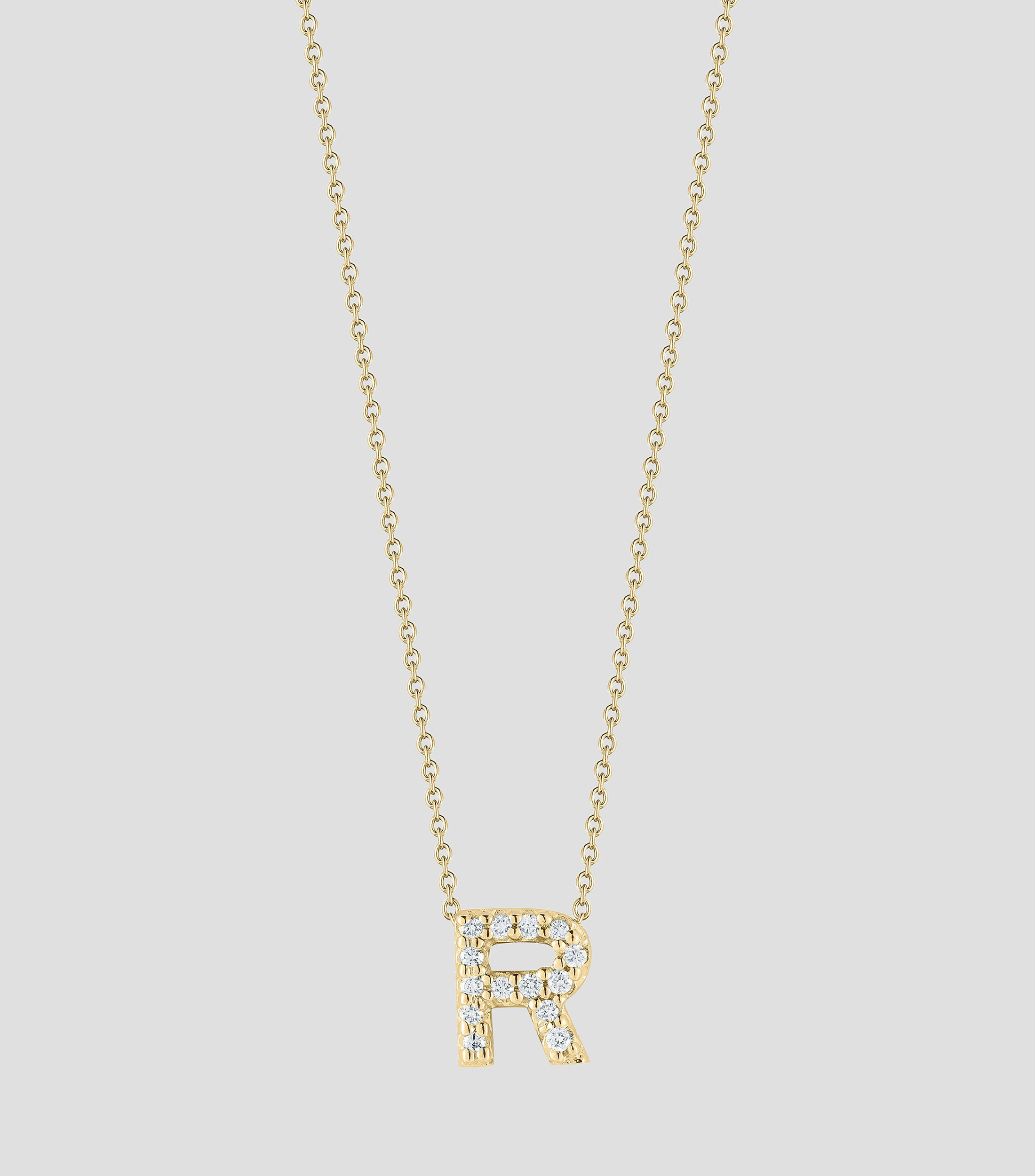 Collar en Oro amarillo de 18 Kilates letra R con diamantes Mujer