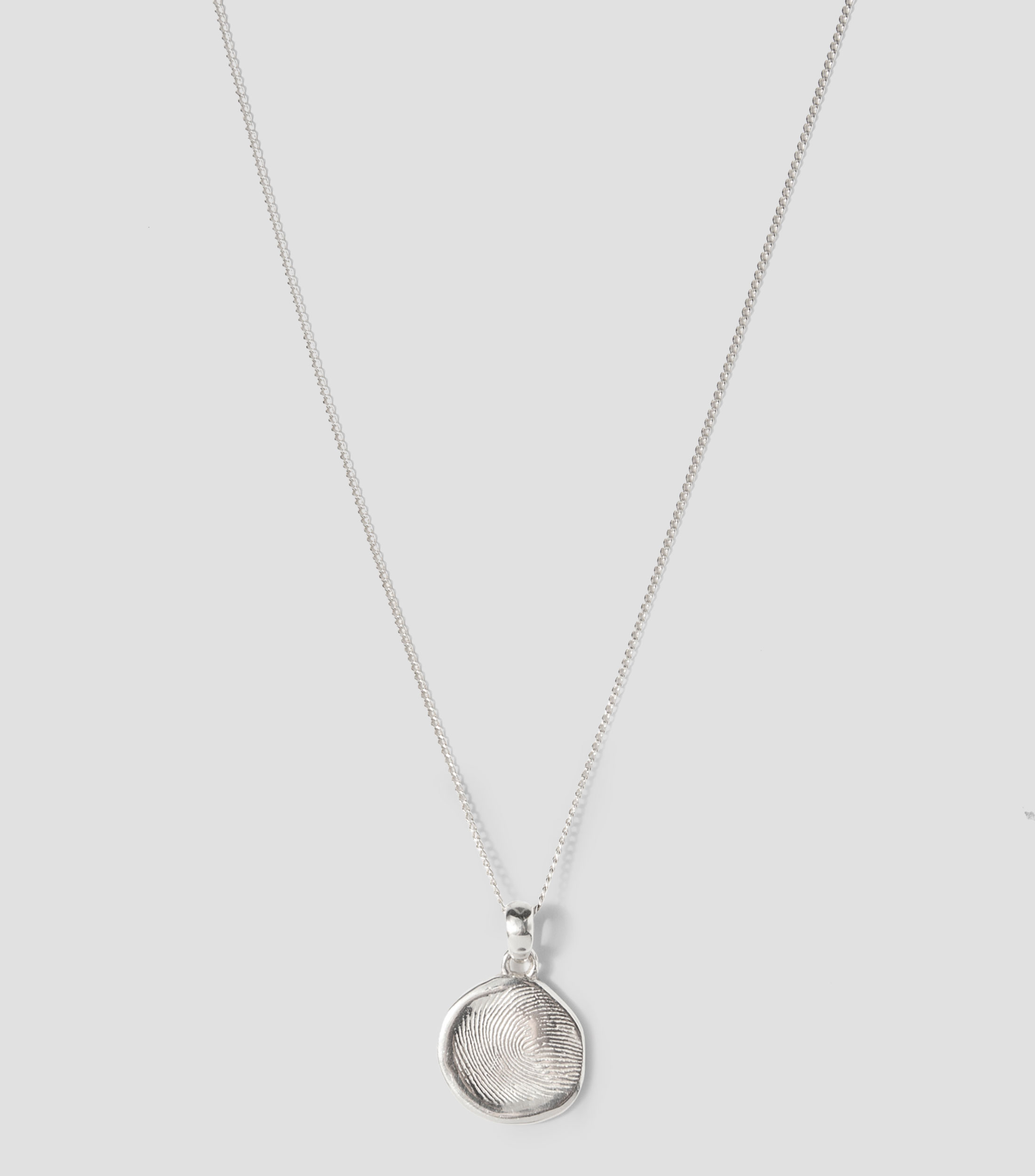 Dije en plata Mujer