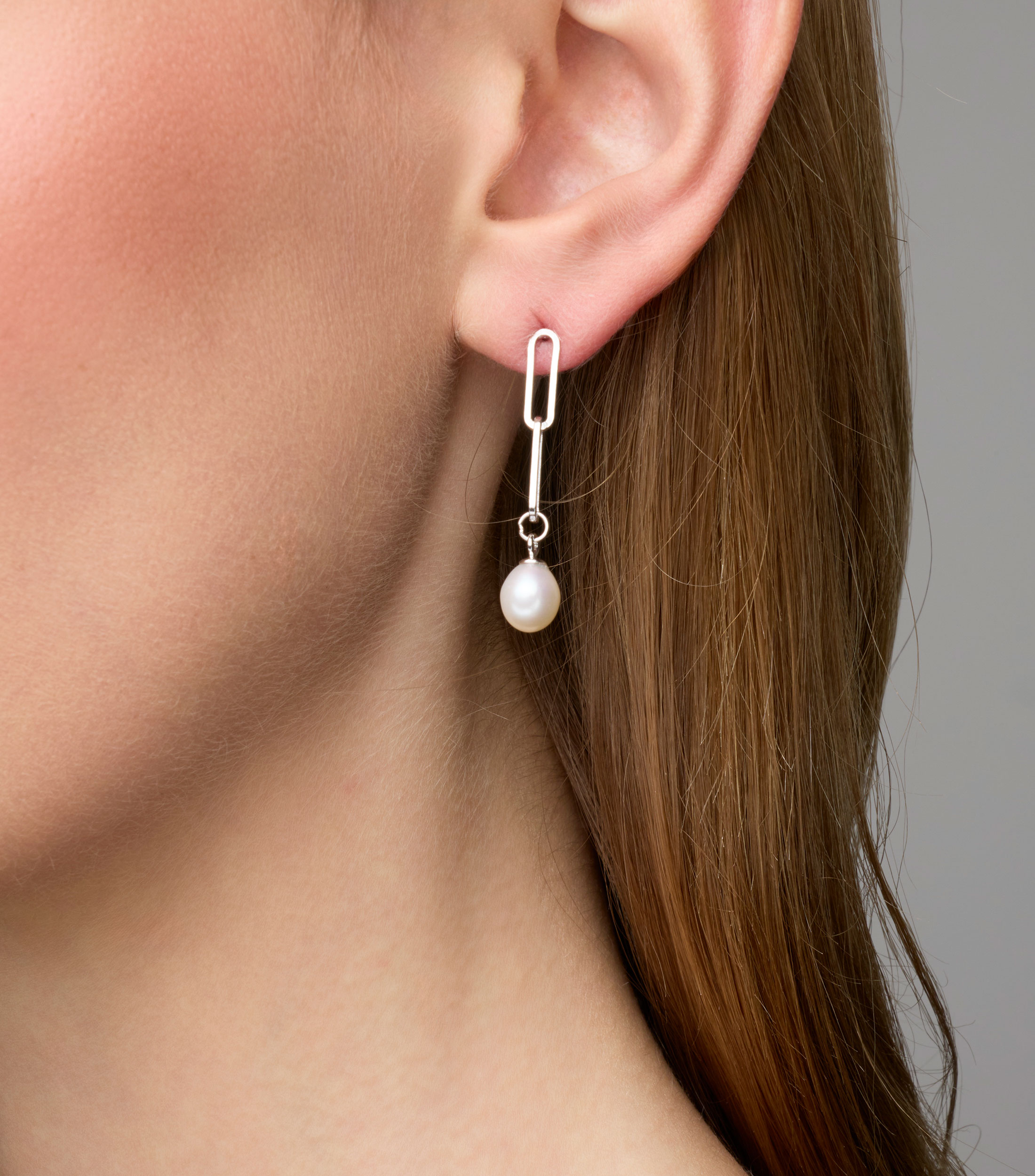 Broqueles en plata con perla blanca Mujer
