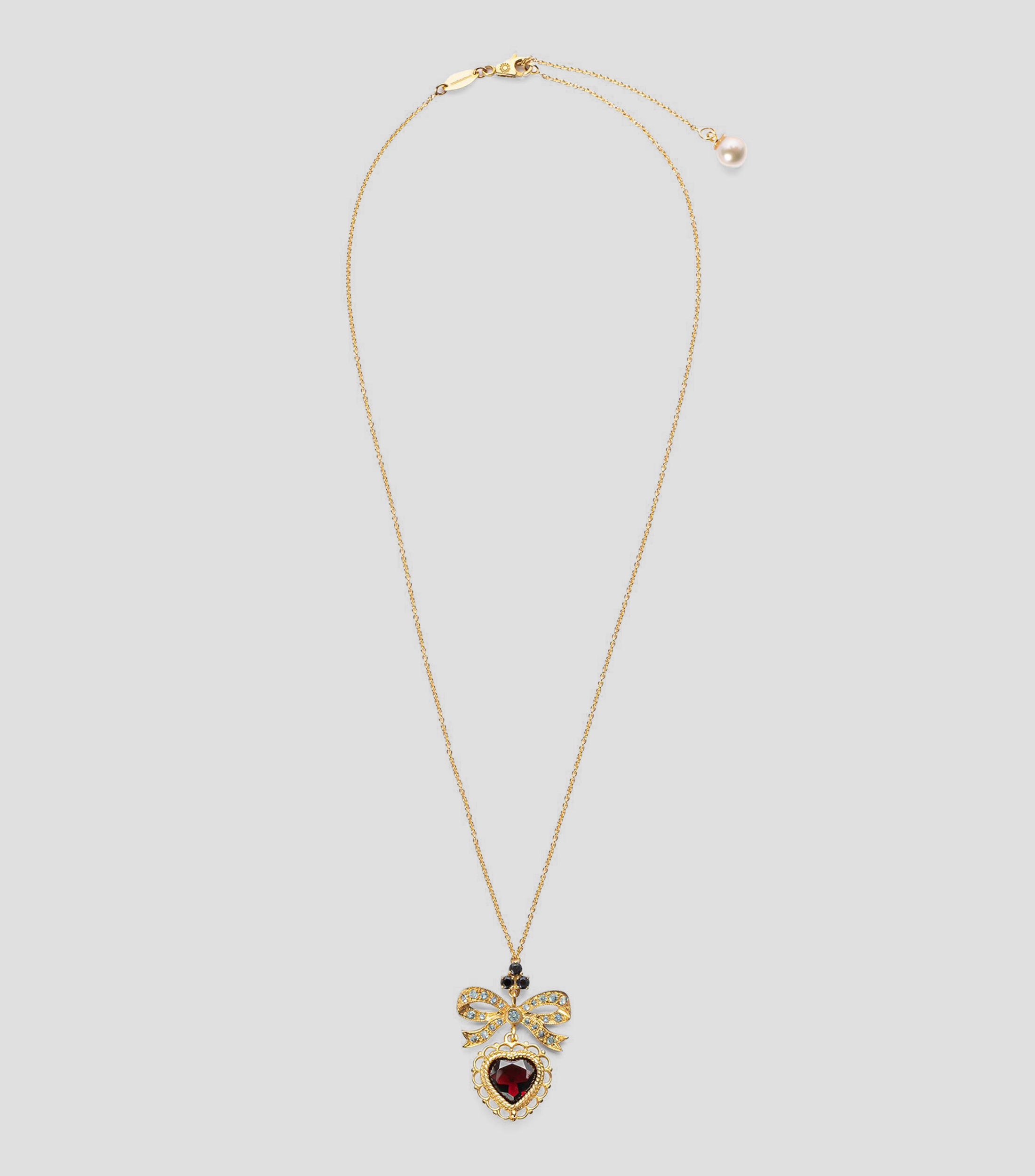 Collar con corazón en Oro de 18 Kilates con moño Devotion Mujer