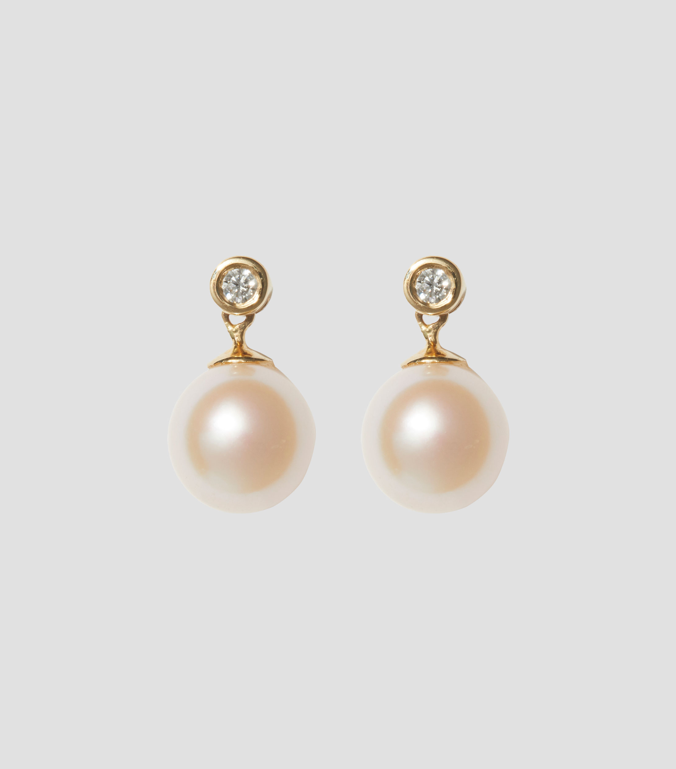 Aretes en oro de 14 kilates con perla Mujer