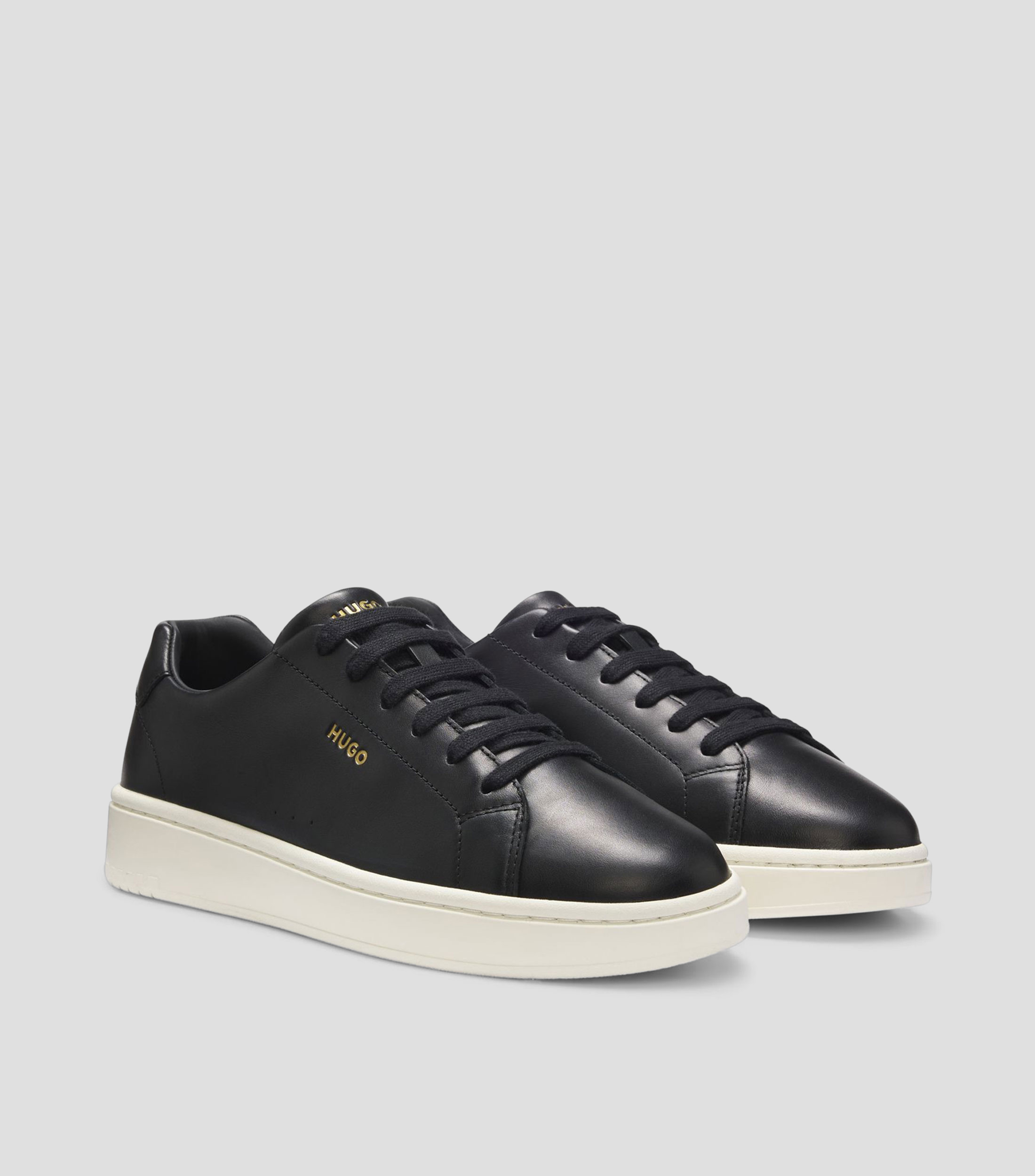 Tenis de piel de napa con logo en tono dorado Hombre