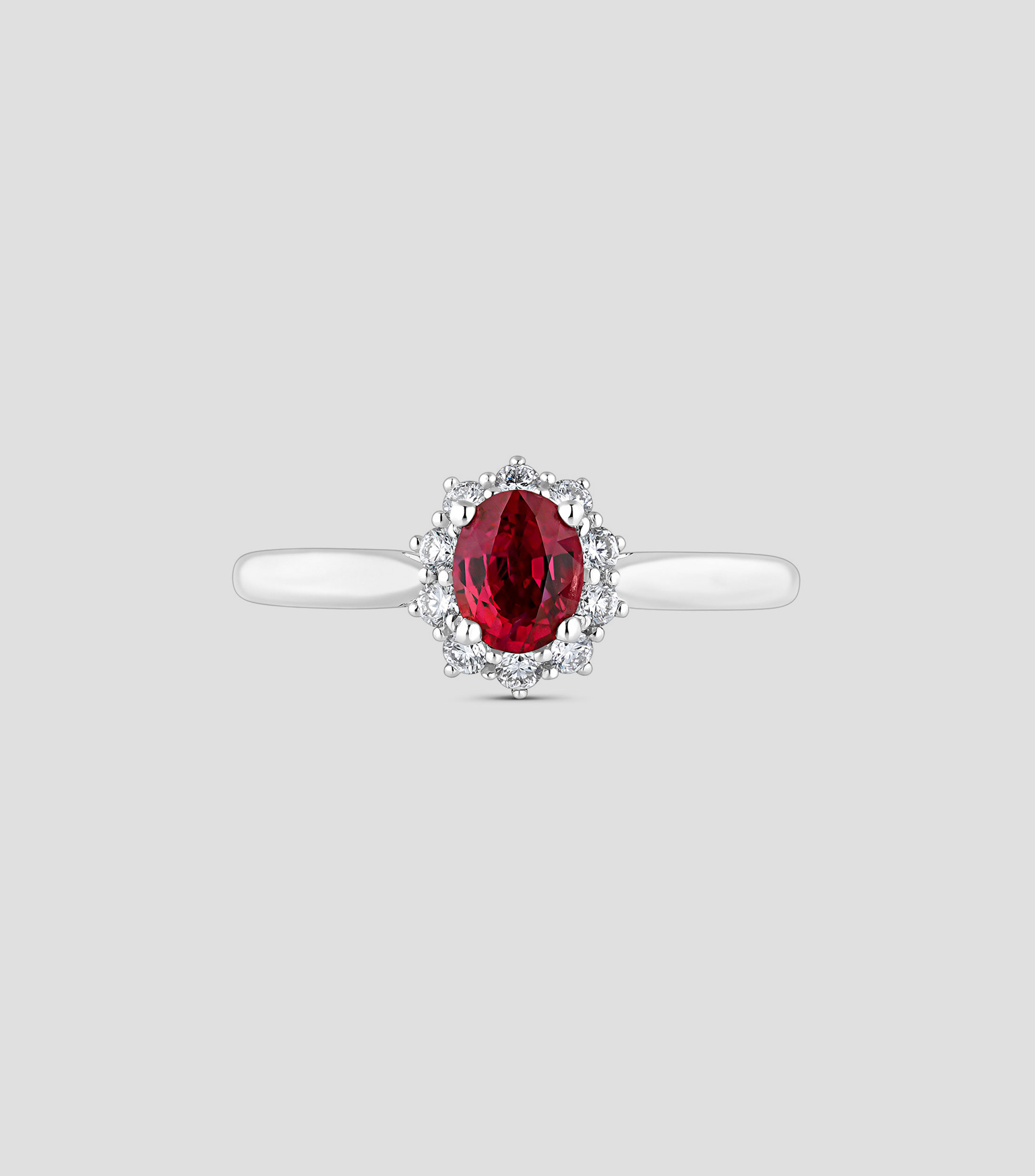 Anillo de Oro Blanco de 18 Kilates con Rubi Rojo y Orla De Diamantes Mujer