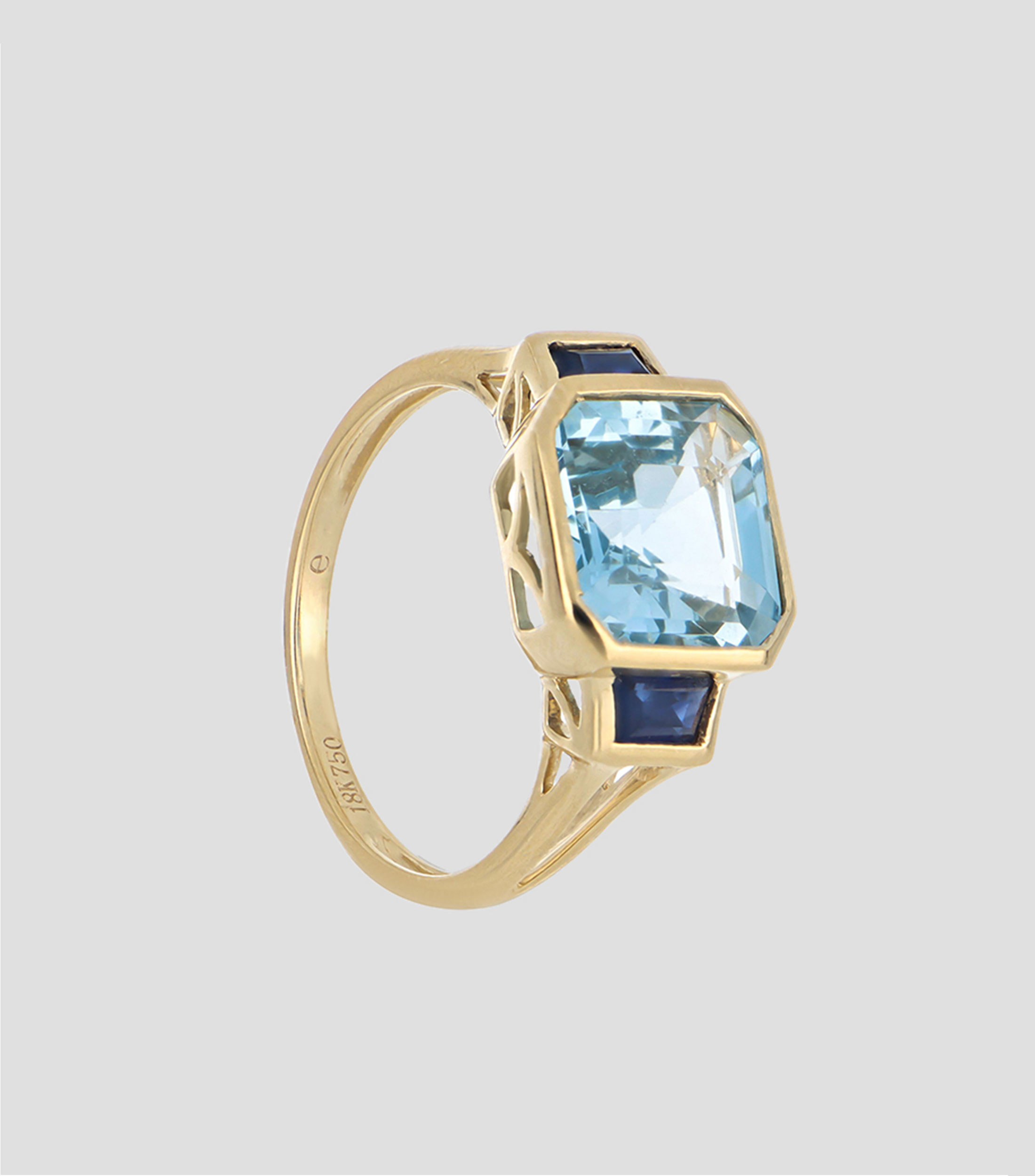 Anillo en oro amarillo 18 kilates con zafiro y topacio Mujer