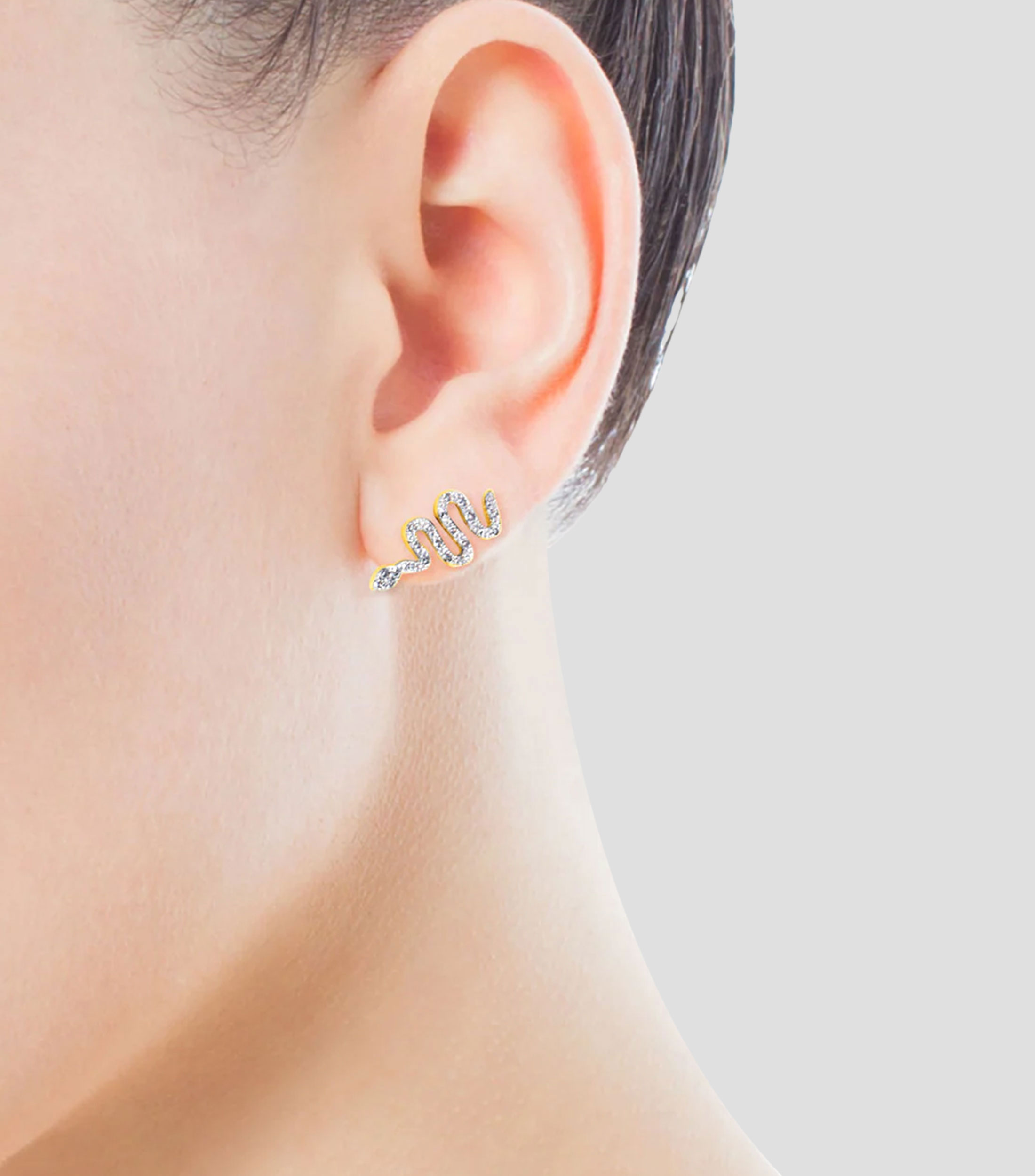 Aretes en oro amarillo 18 Kilates en forma de serpiente con diamantes Gem Power Mujer