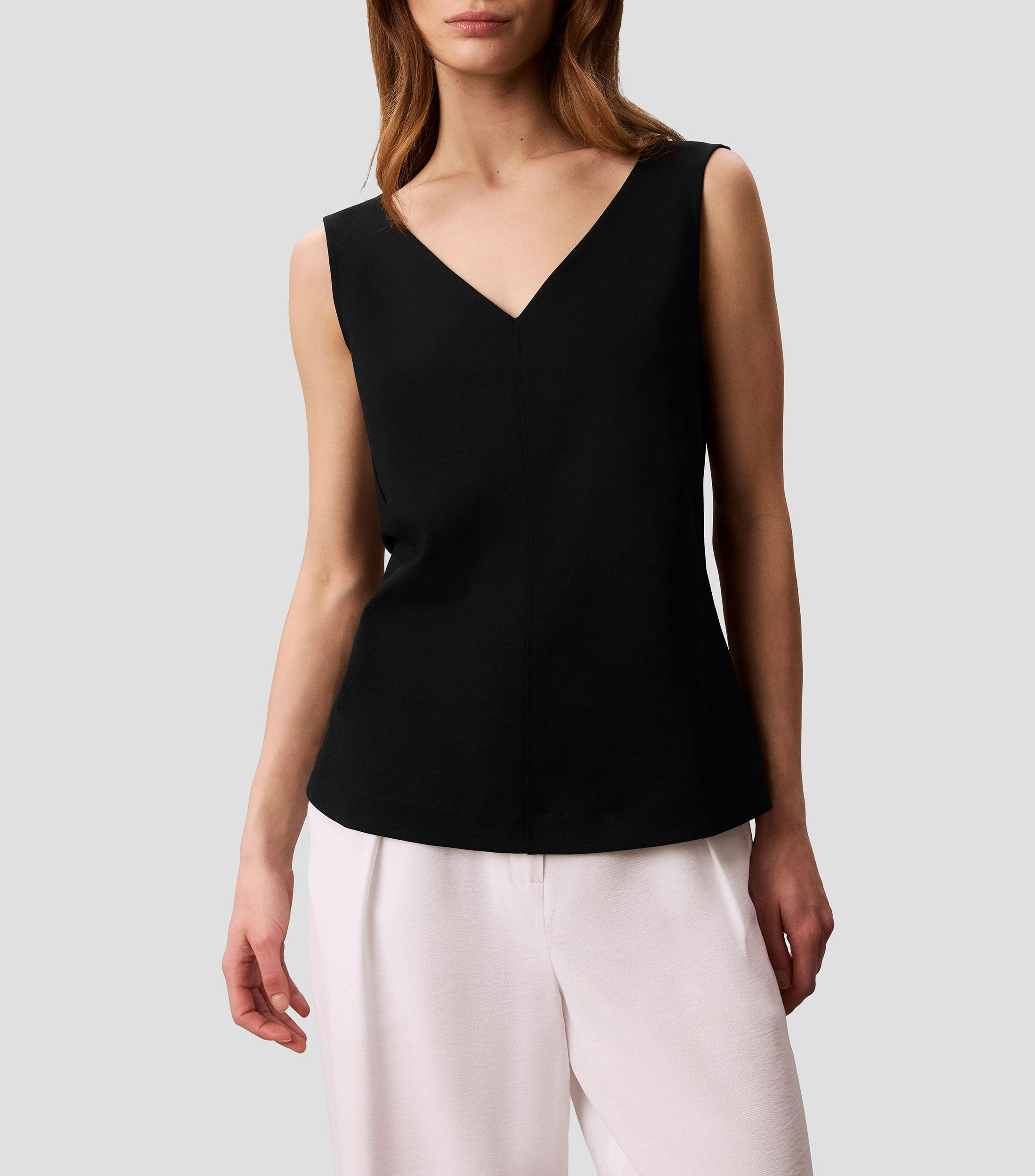 Blusa lisa sin mangas Mujer