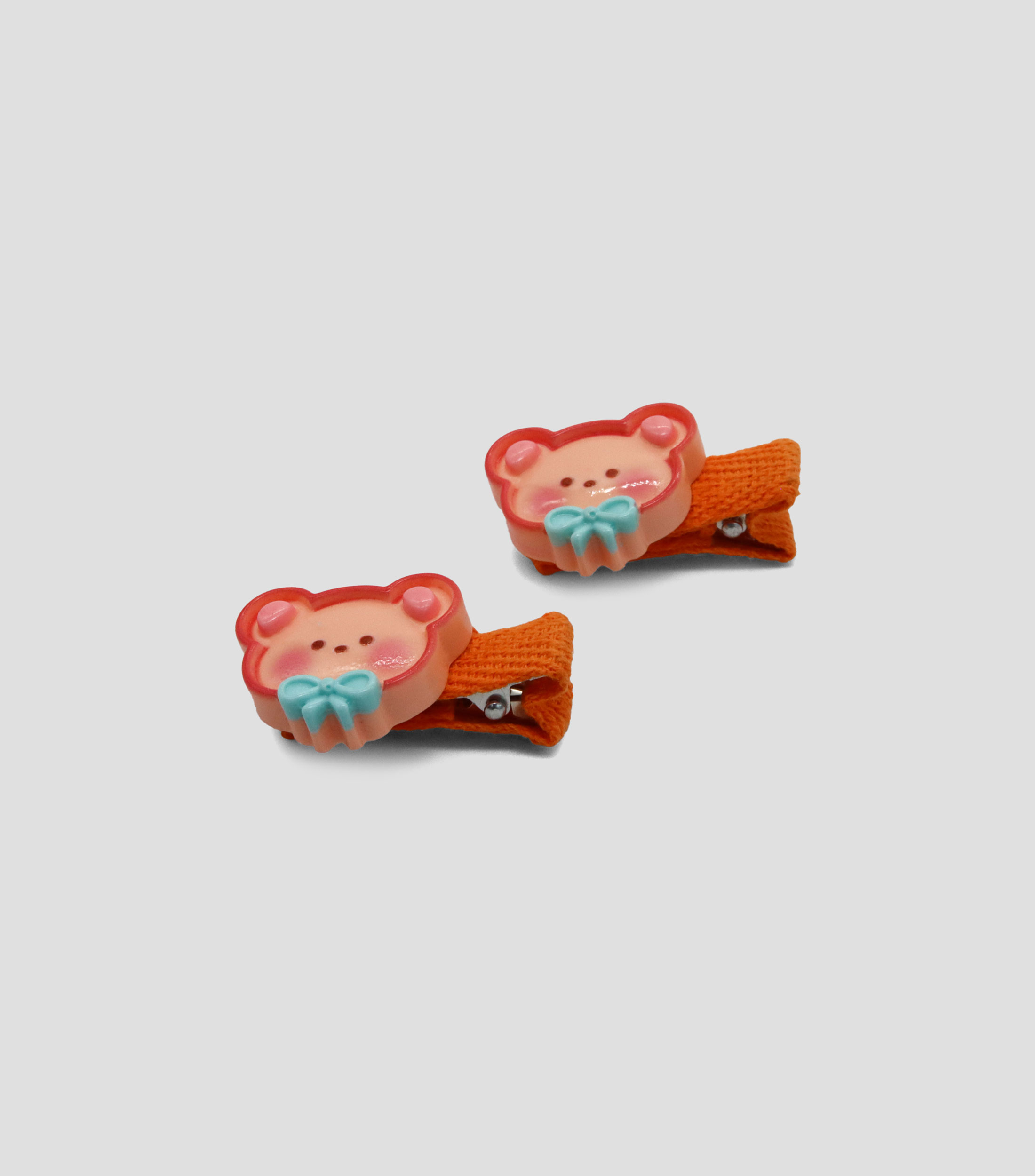 Broches naranja de oso Niña