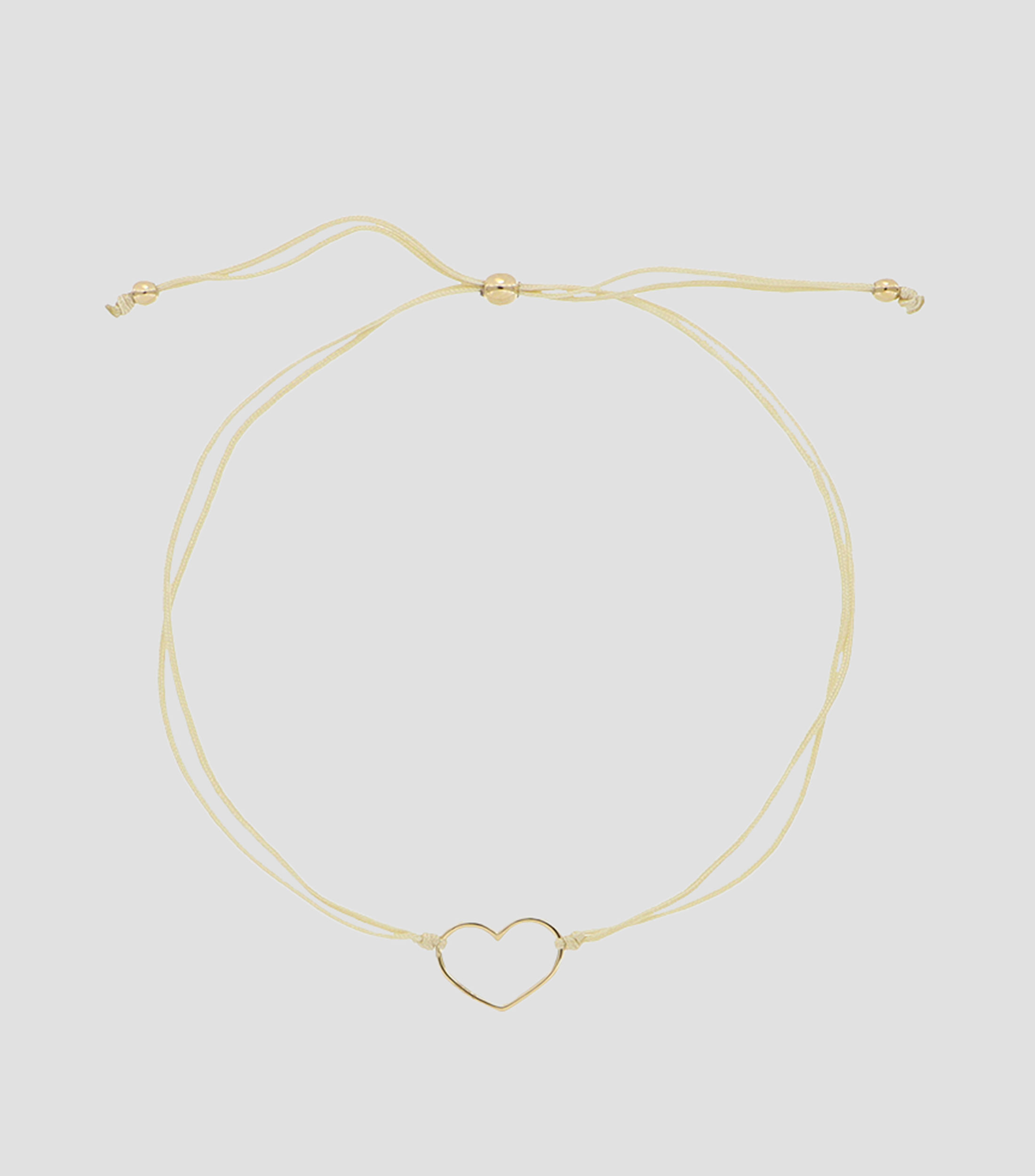 Pulsera en hilo marfil con dije corazón Mujer