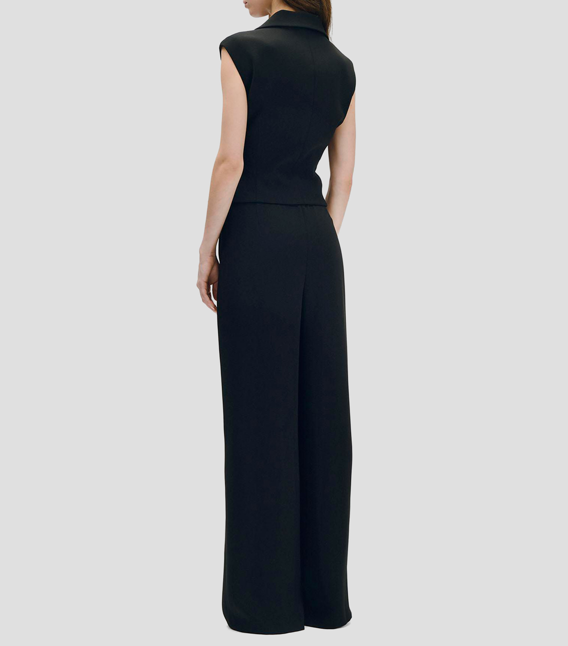 Jumpsuit negro recto fluido con chaleco simulado y cruce con solapa Mujer