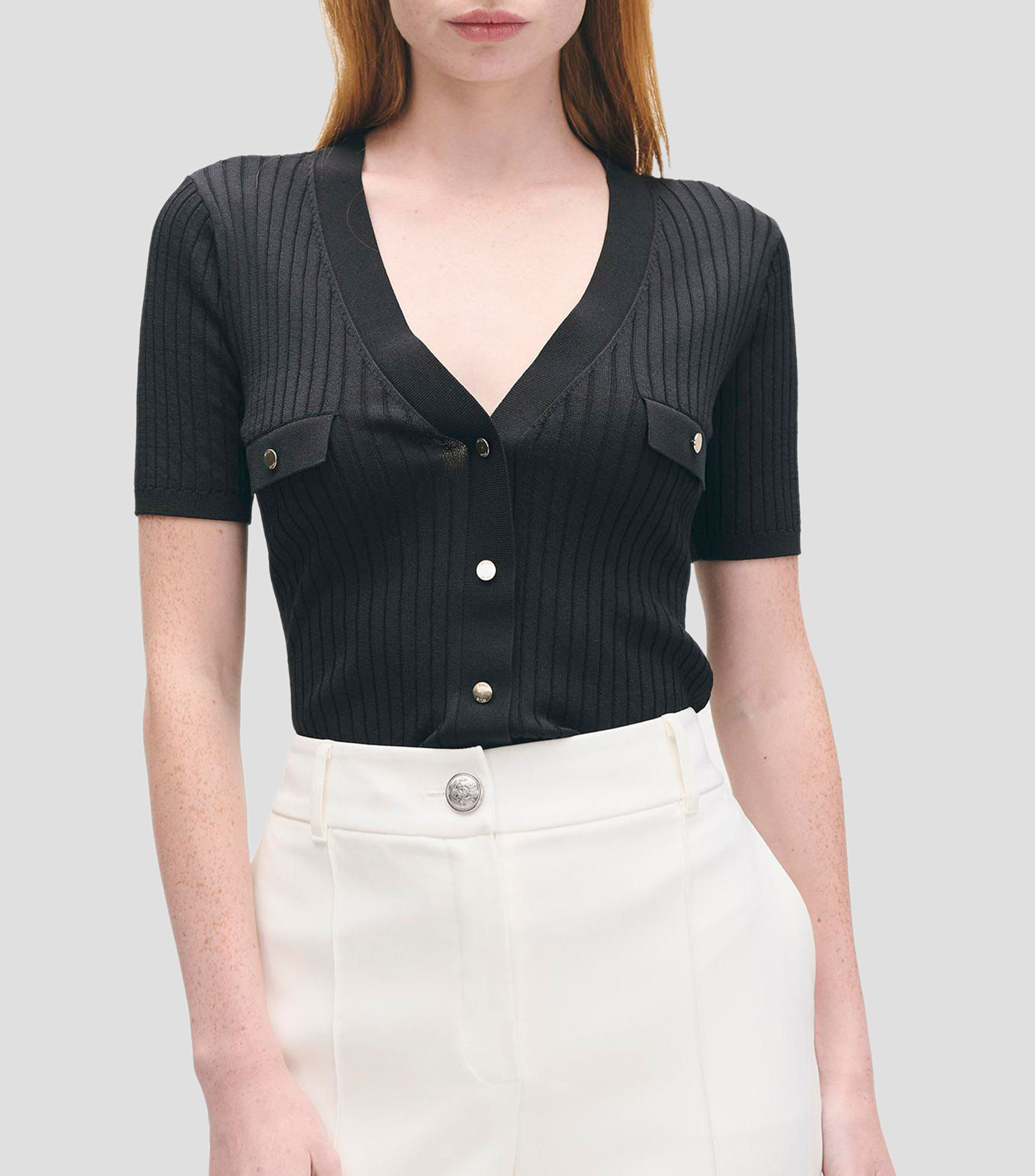 Blusa tejido canalé escote V aletilla y bolsillos simulados Mujer