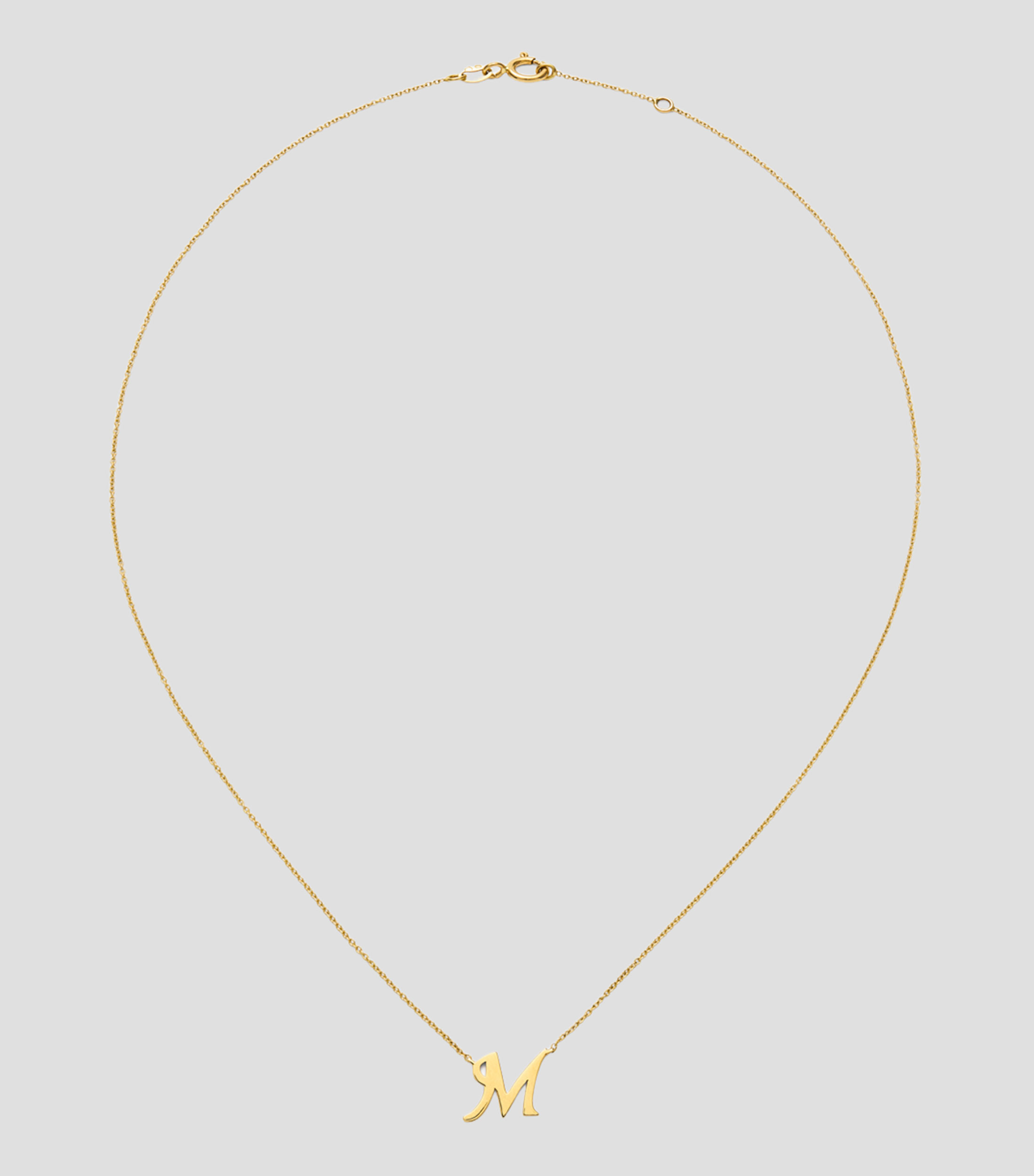 Colgante en oro amarillo de 18 Kilates letra M Mujer