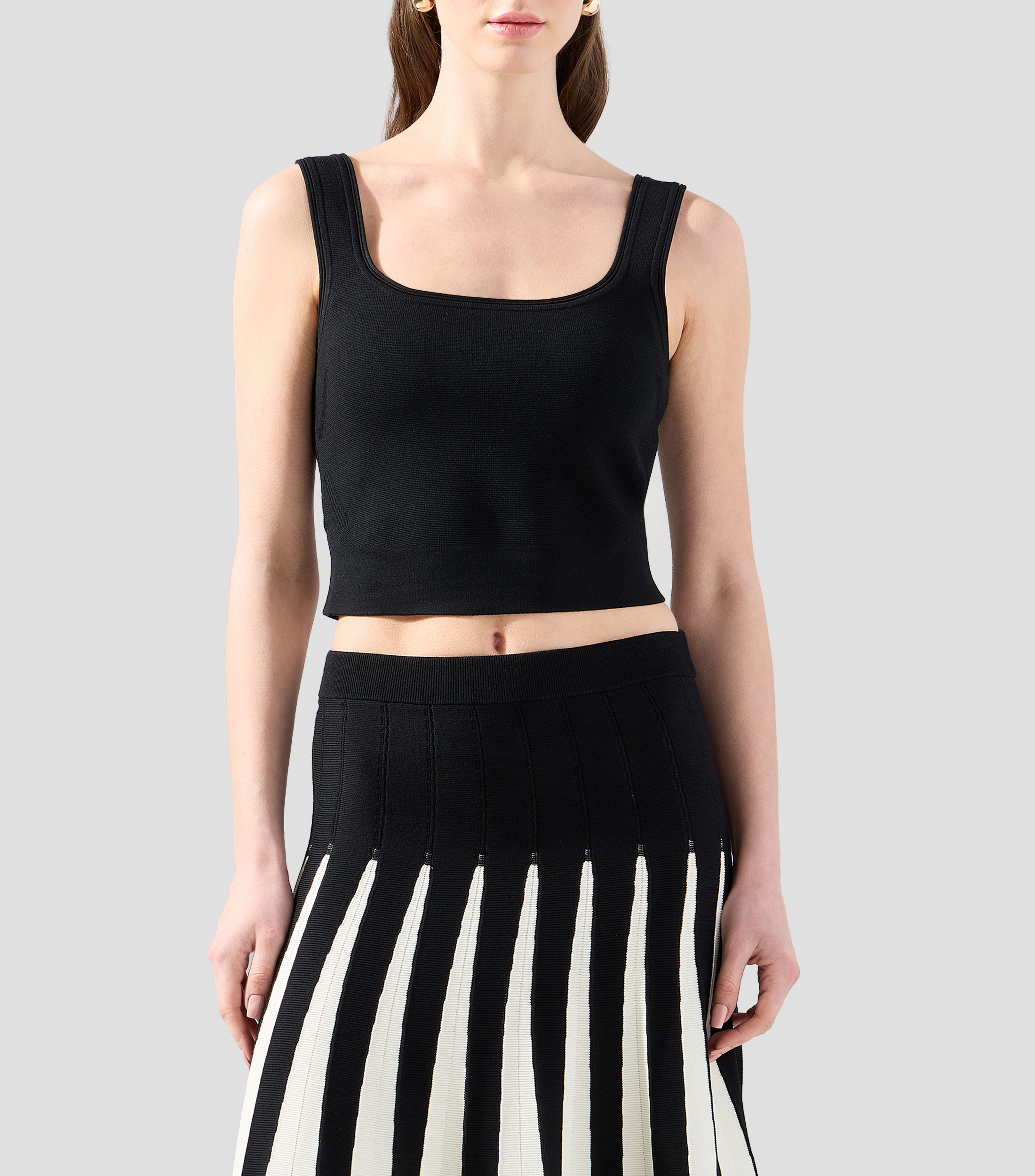 Blusa lisa sin mangas Mujer