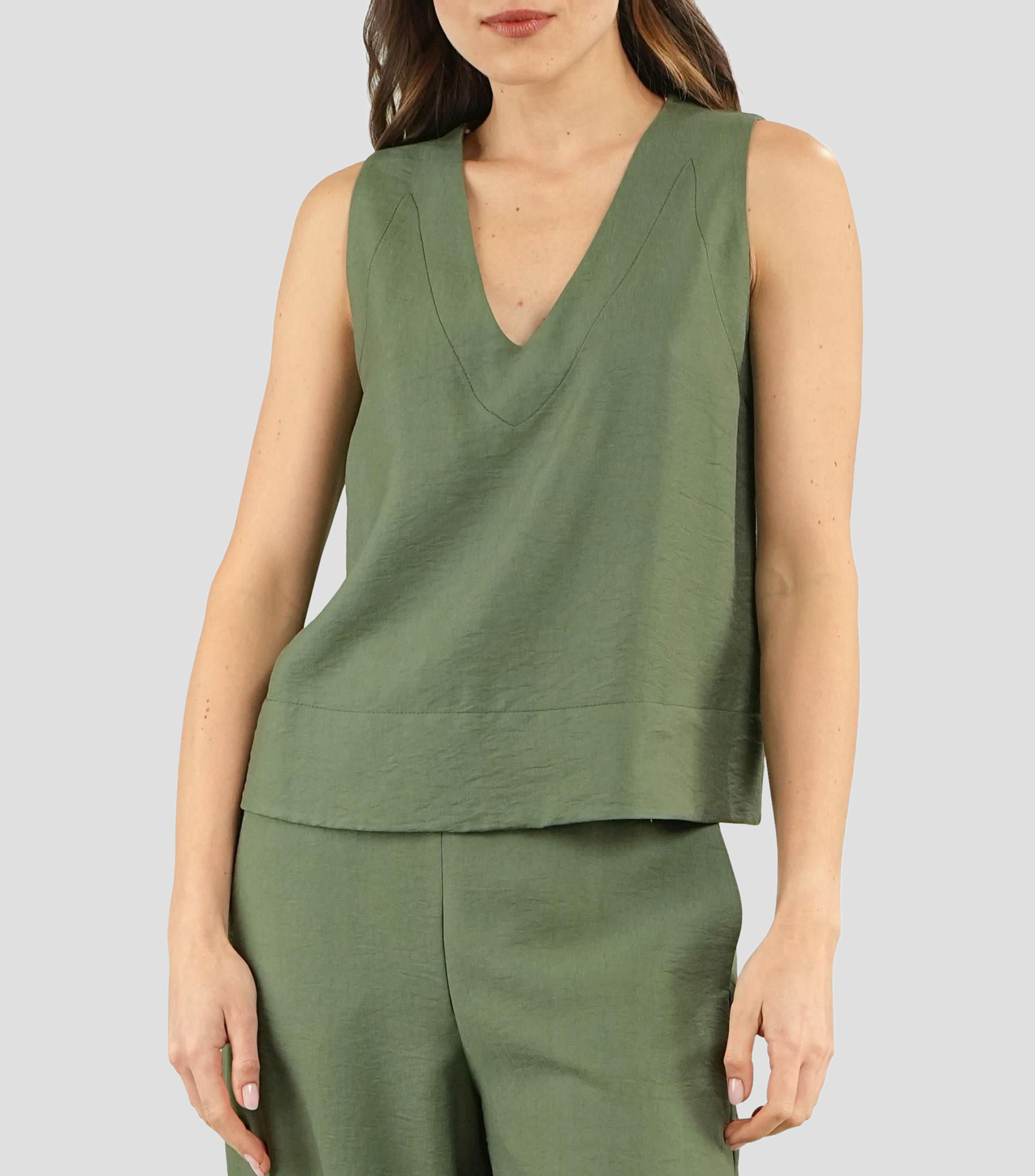 Blusa lisa sin mangas Mujer