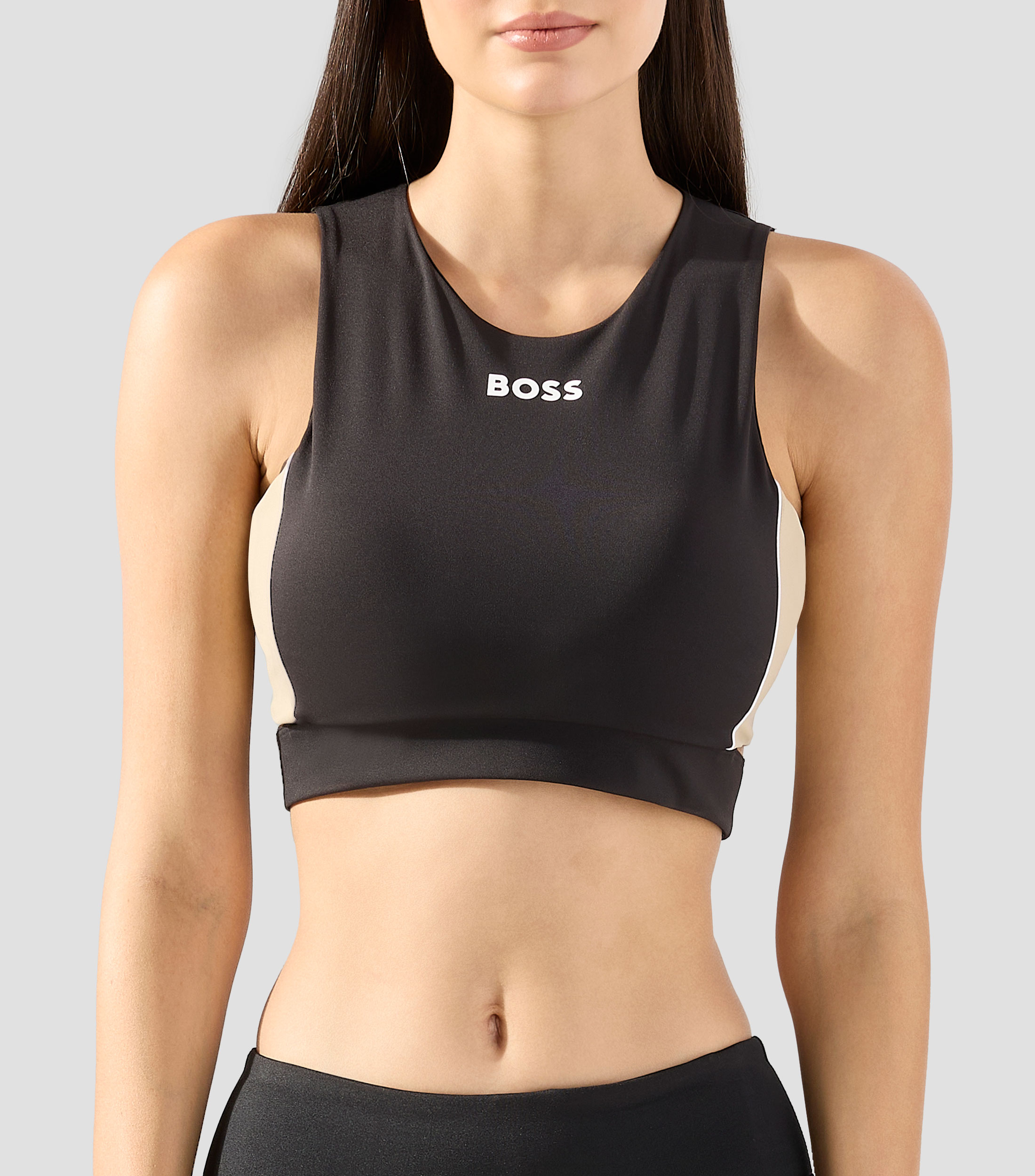 Top deportivo en interlock elastico con detalles de aberturas Mujer