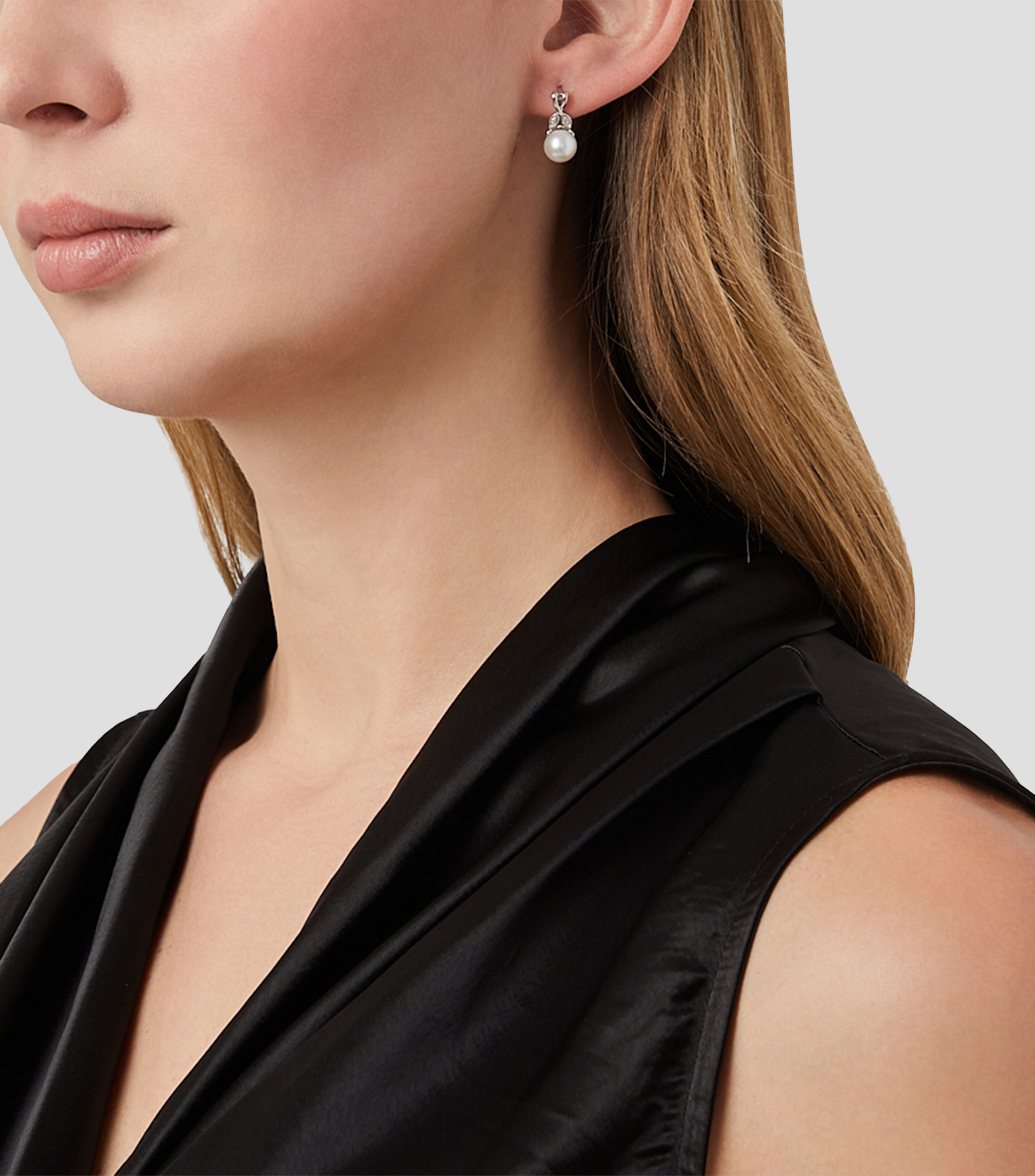 Aretes en oro blanco de 14 kilates con perla Mujer