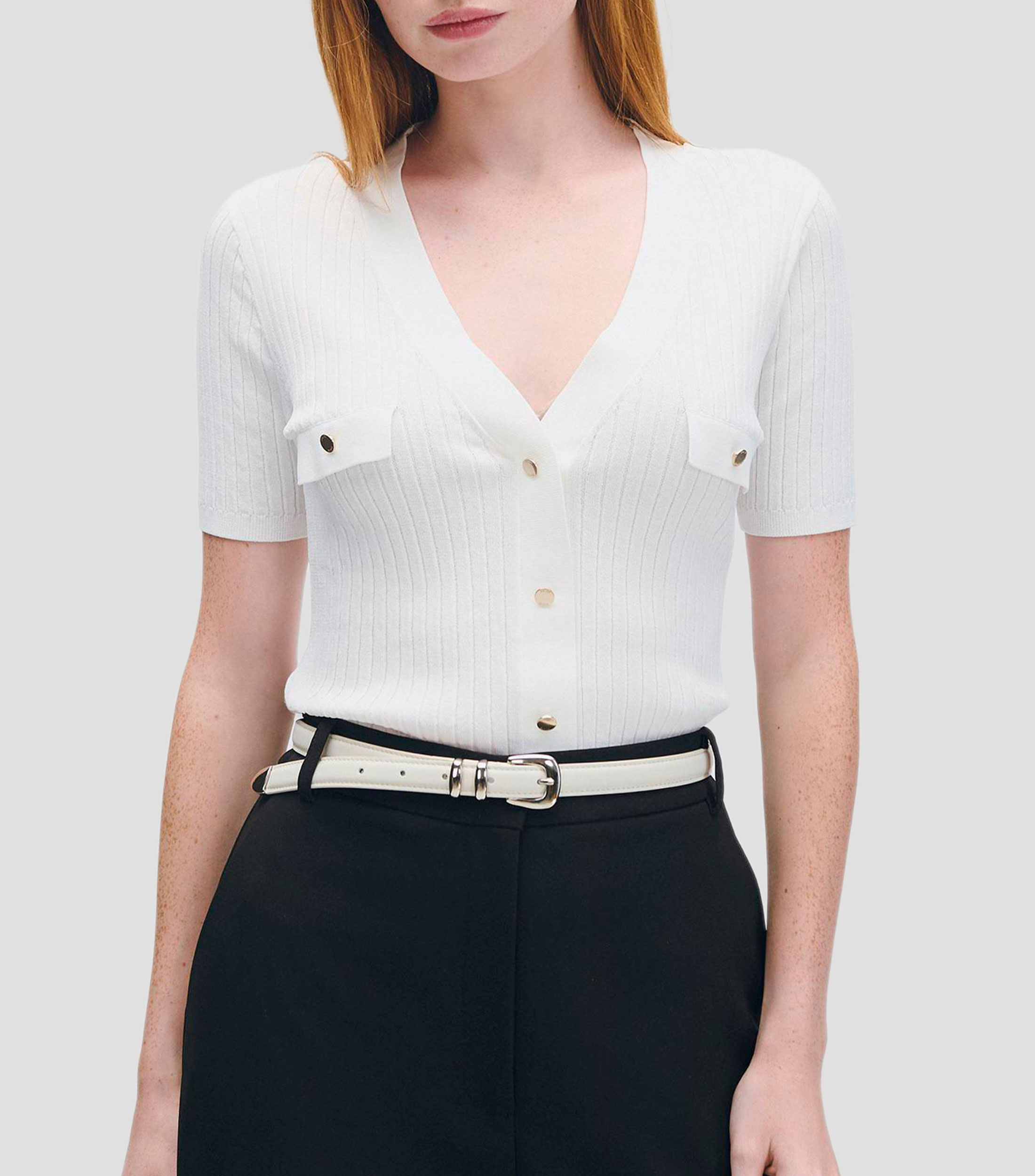 Blusa tejido canalé escote V aletilla y bolsillos simulados Mujer