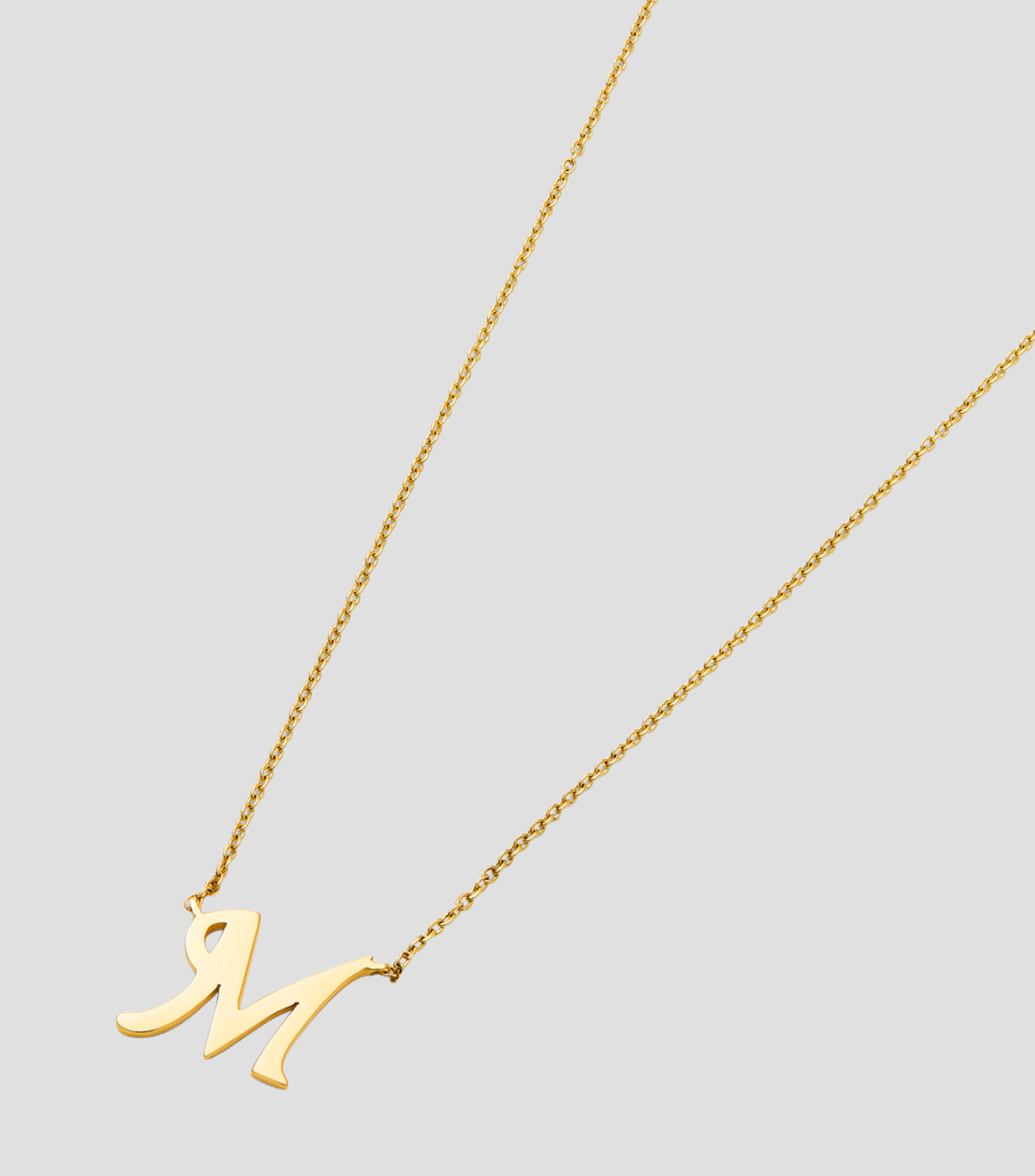 Colgante en oro amarillo de 18 Kilates letra M Mujer