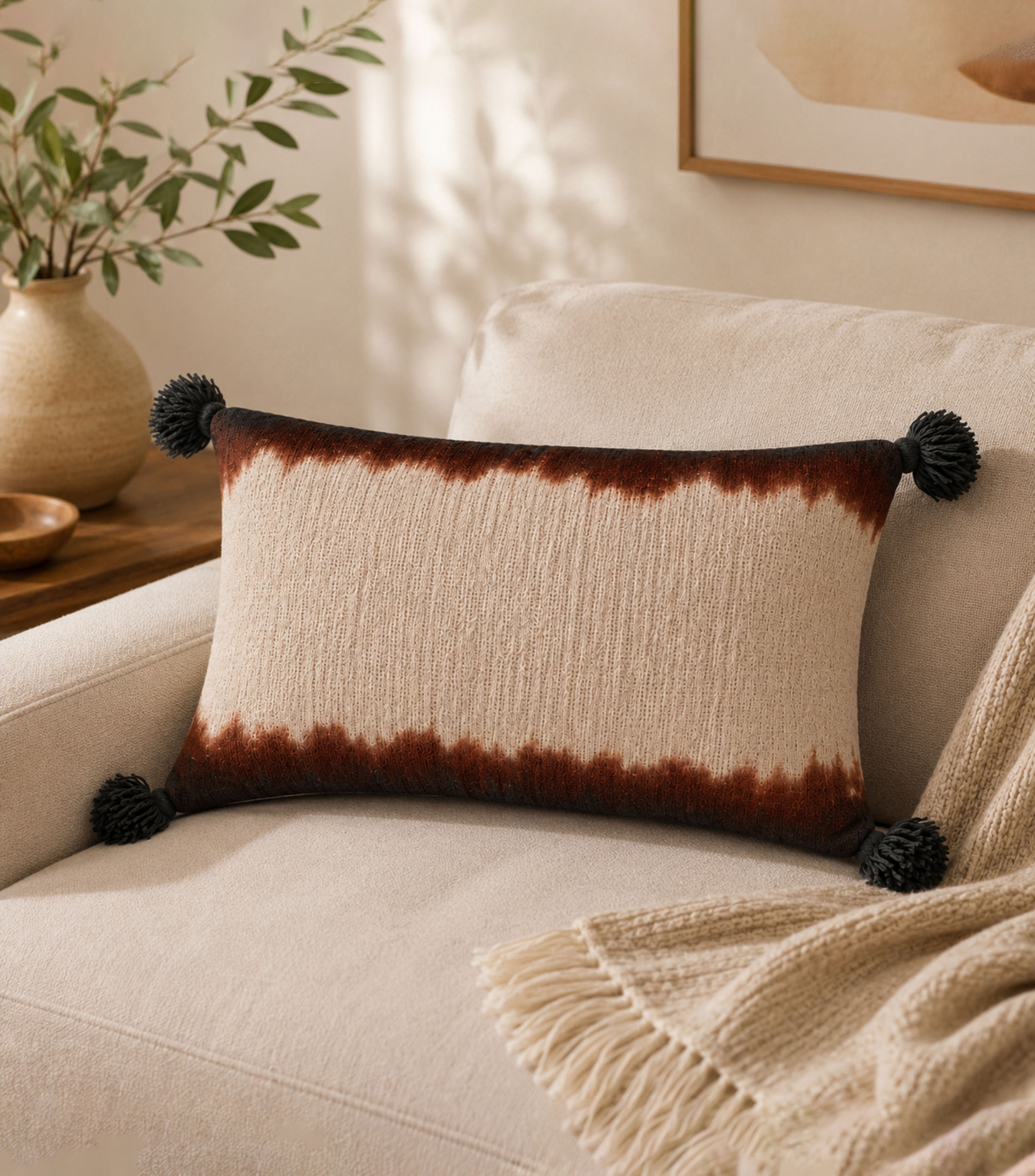 Cojín decorativo con borlas