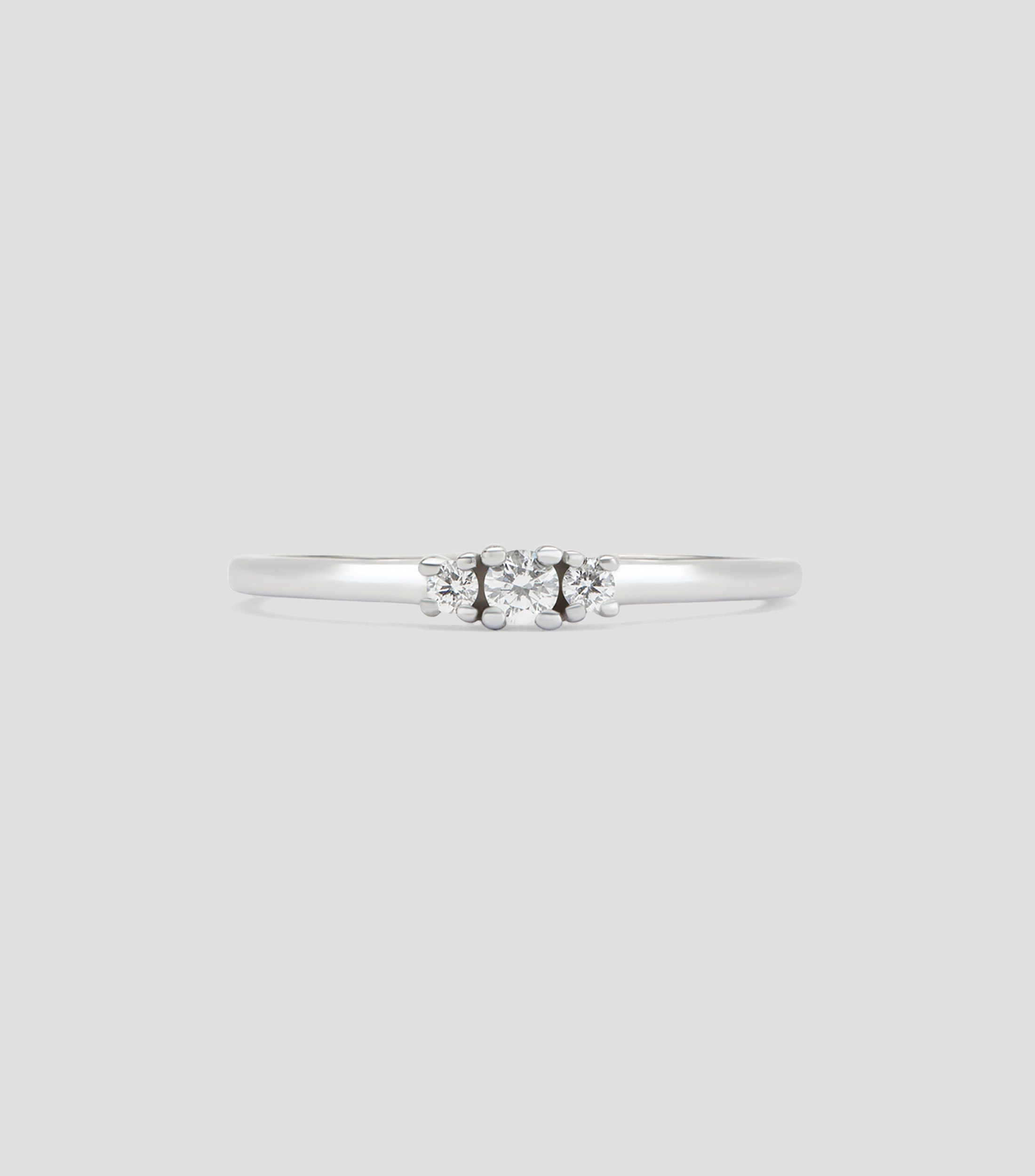 Anillo tresillo en Oro blanco de 18 Kilates con diamantes Mujer