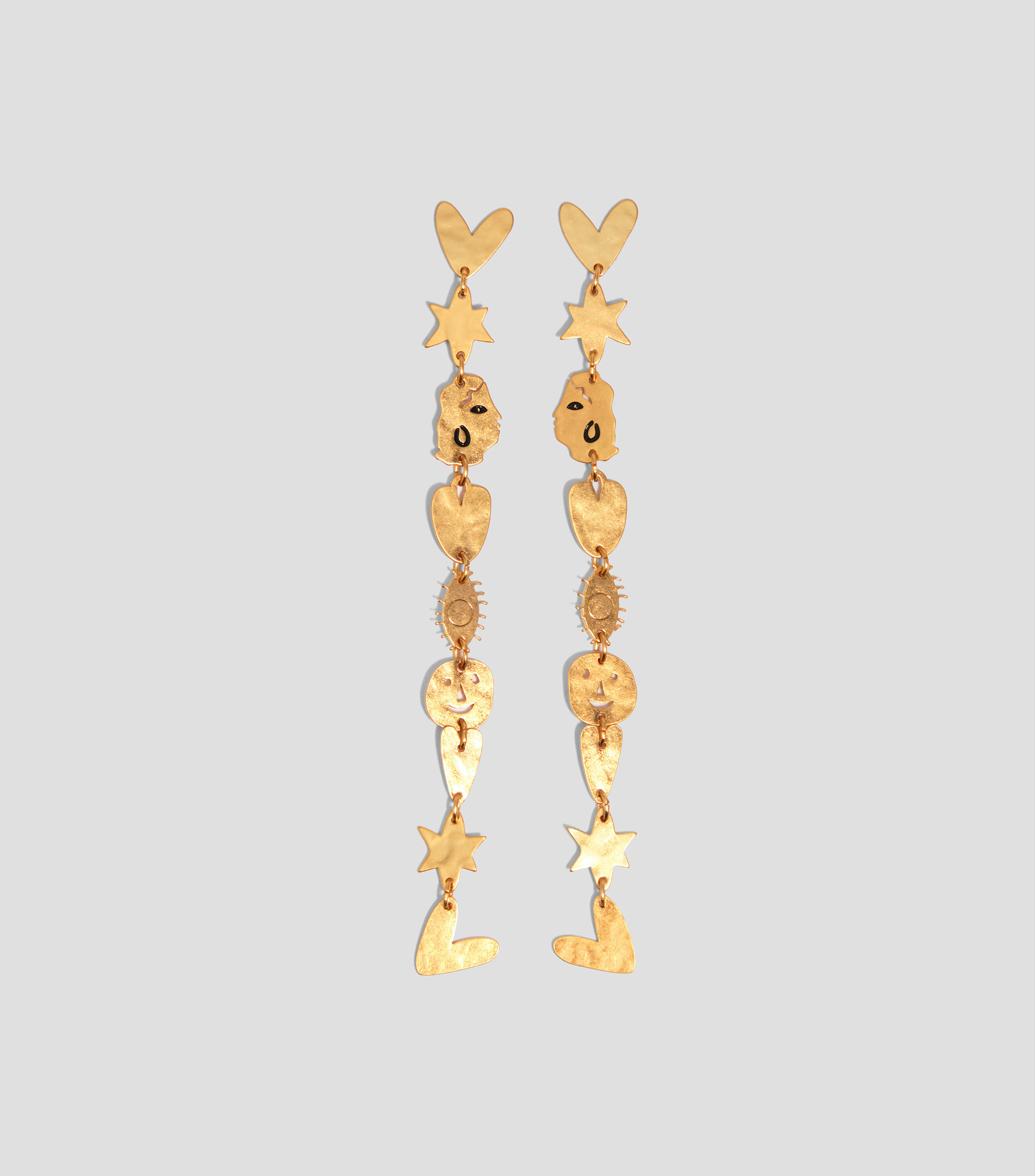 Aretes siluetas metal dorado mate Mujer