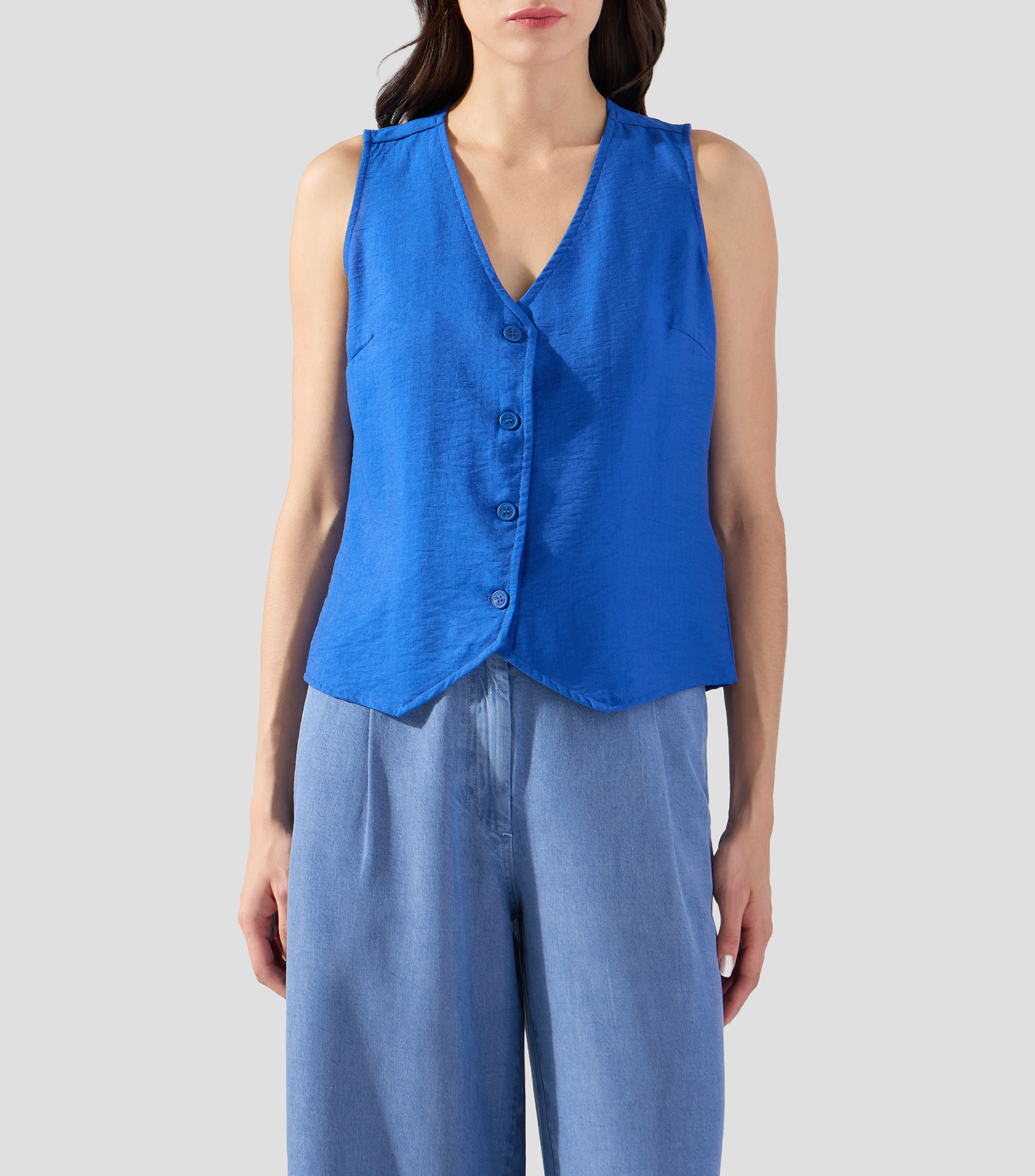 Blusa lisa sin mangas Mujer