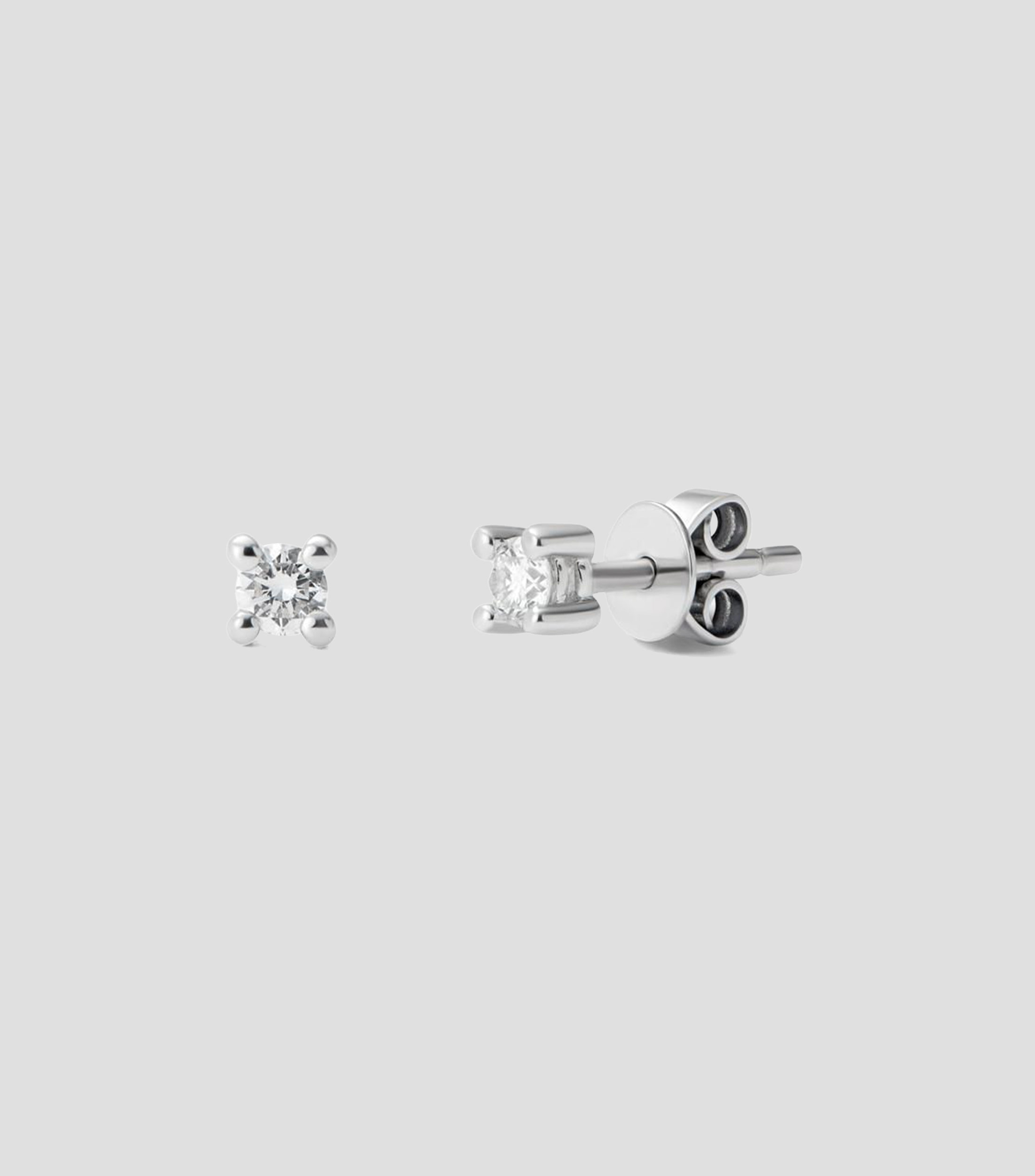 Aretes solitarios en Oro blanco de 18 Kilates con 2 diamantes en talla brillante Mujer