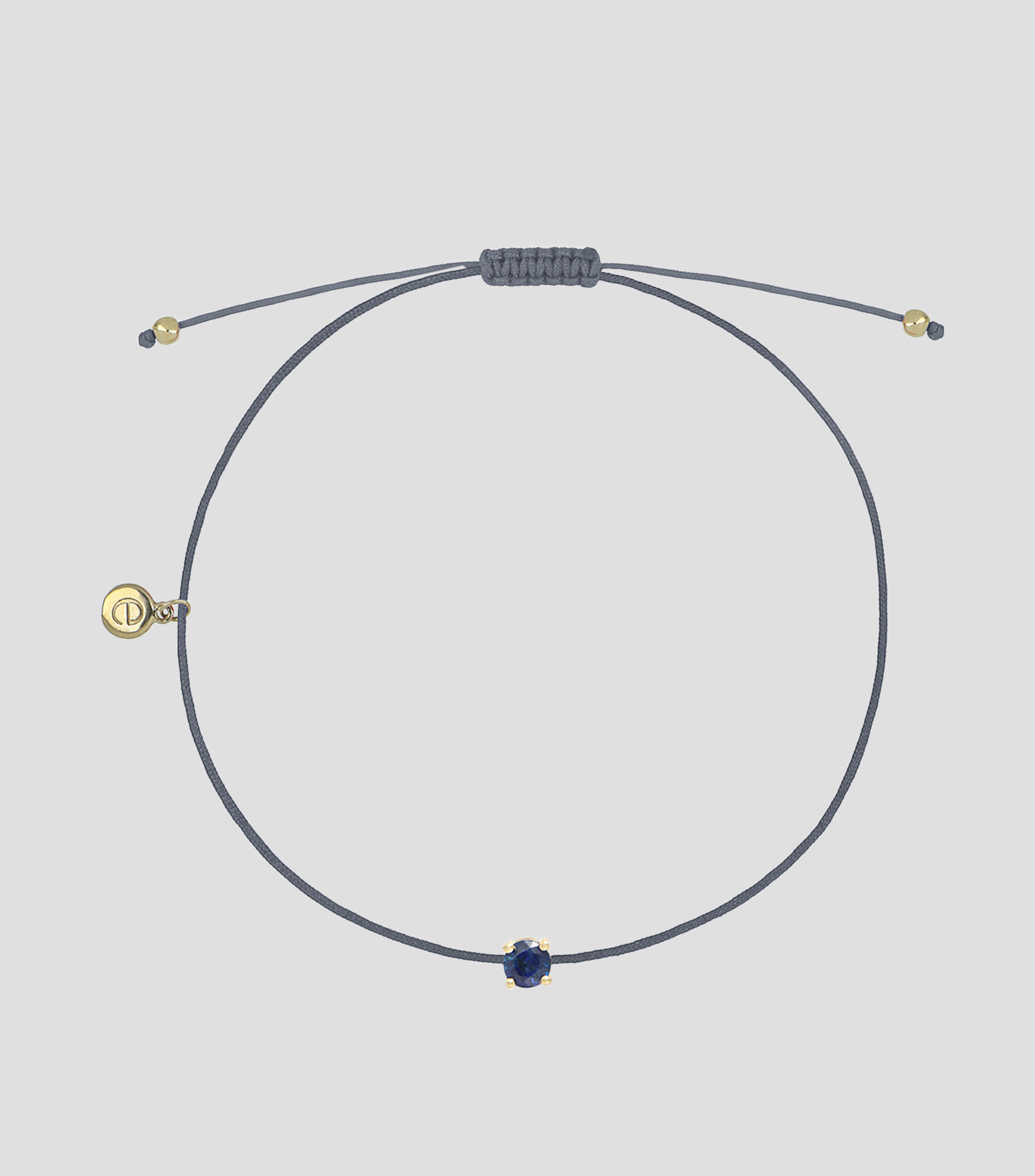 Pulsera con Dije en Oro Amarillo de 18 Kilates con Zafiro Mujer