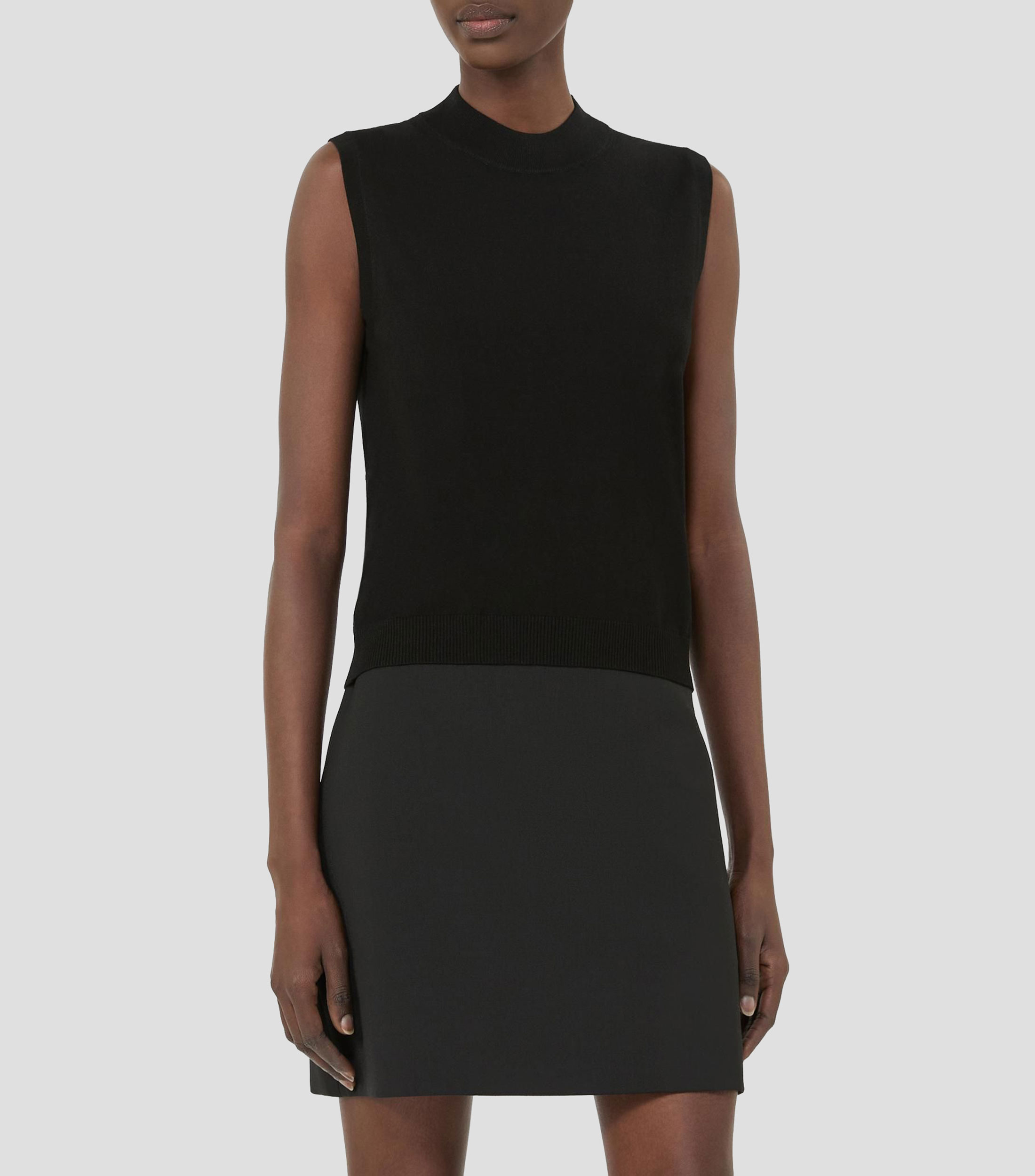 Blusa lisa sin mangas Mujer