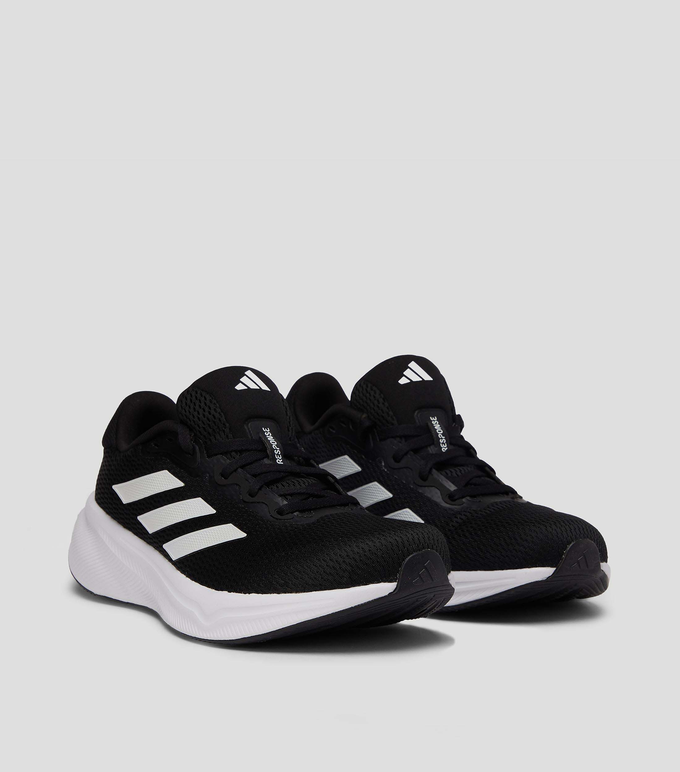 Tenis deportivos Response con franjas Hombre