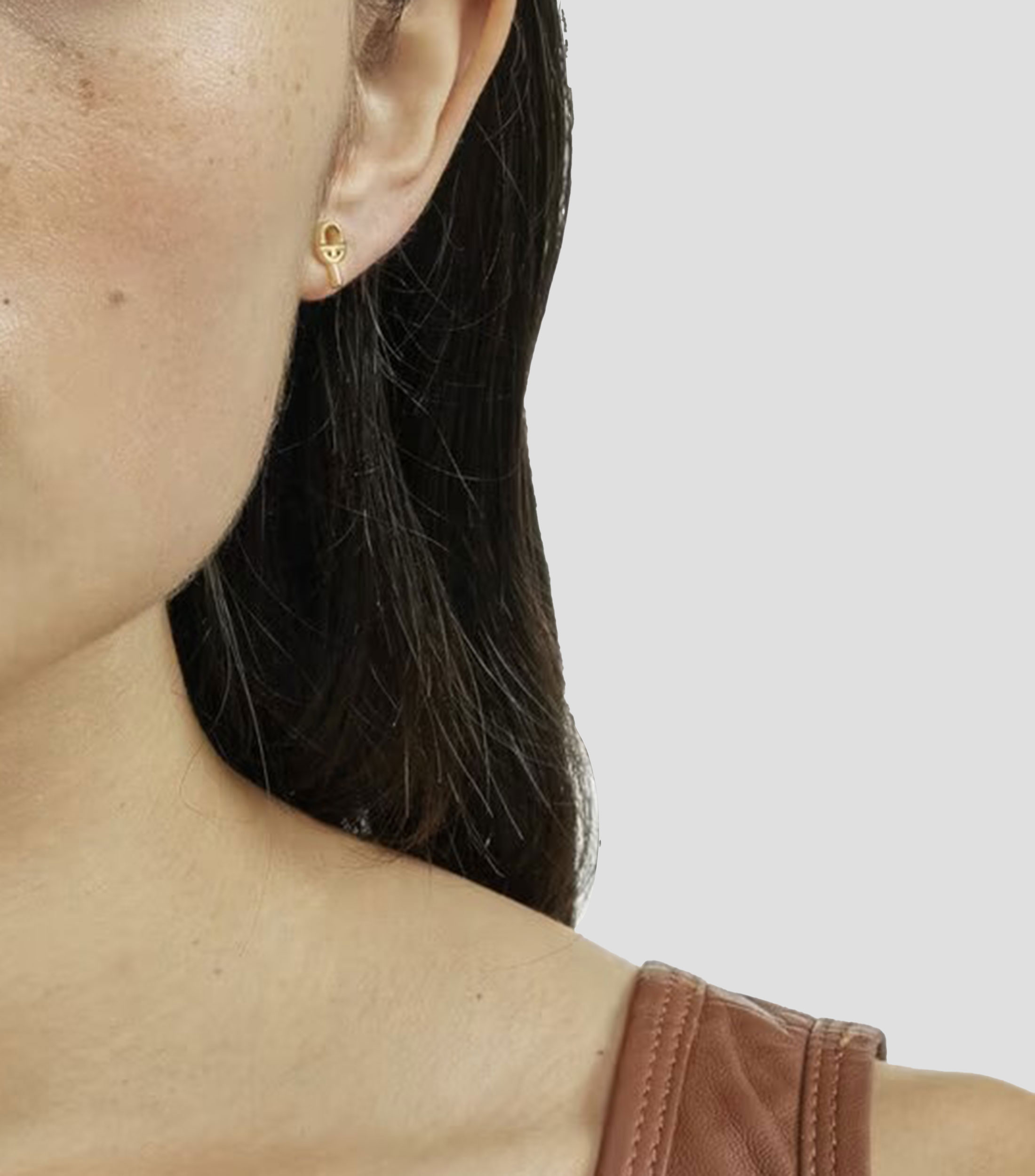 Aretes Manifesto en plata dorada Mujer