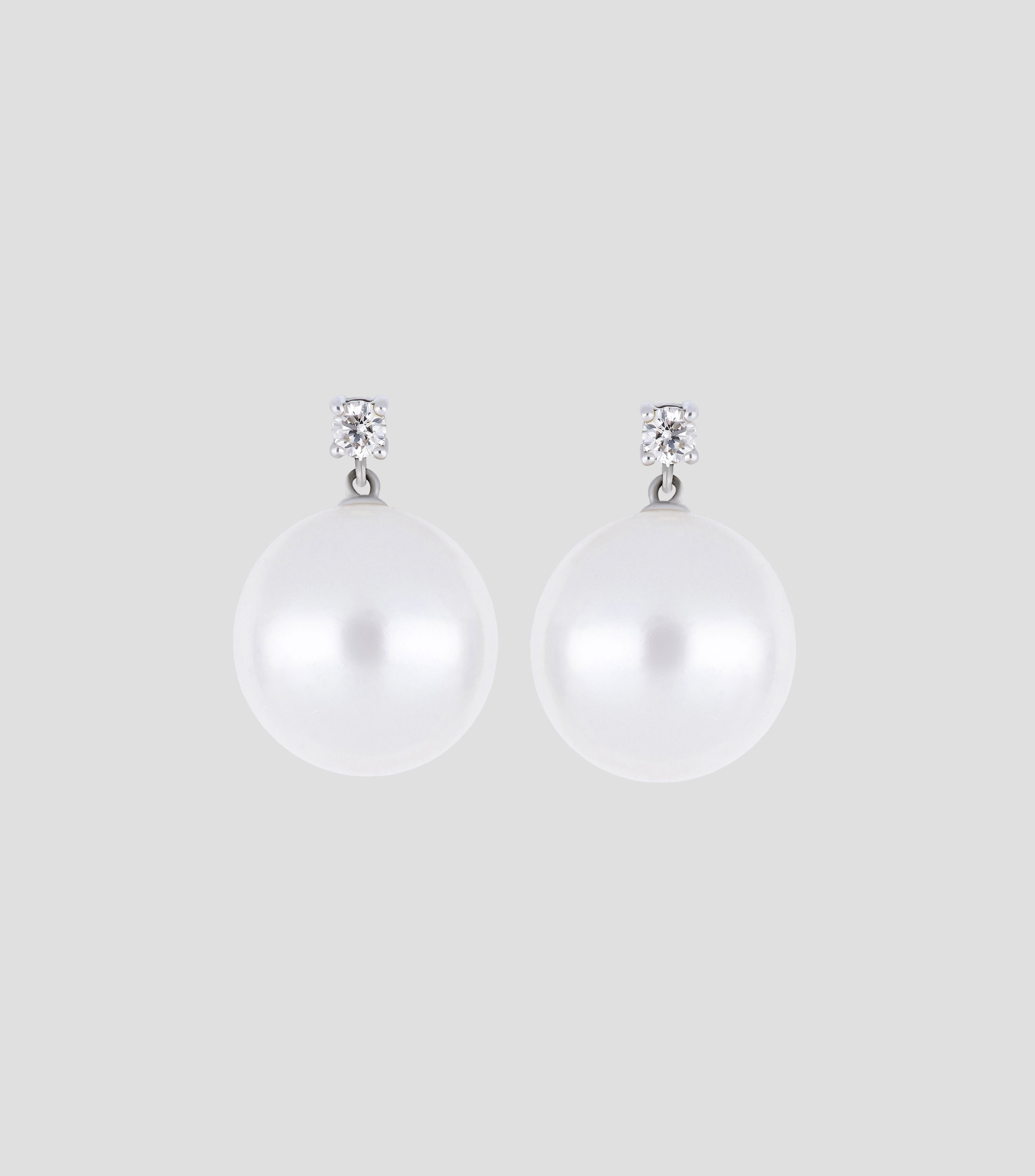 Broqueles en oro blanco 14 Kts con perla y diamante Mujer