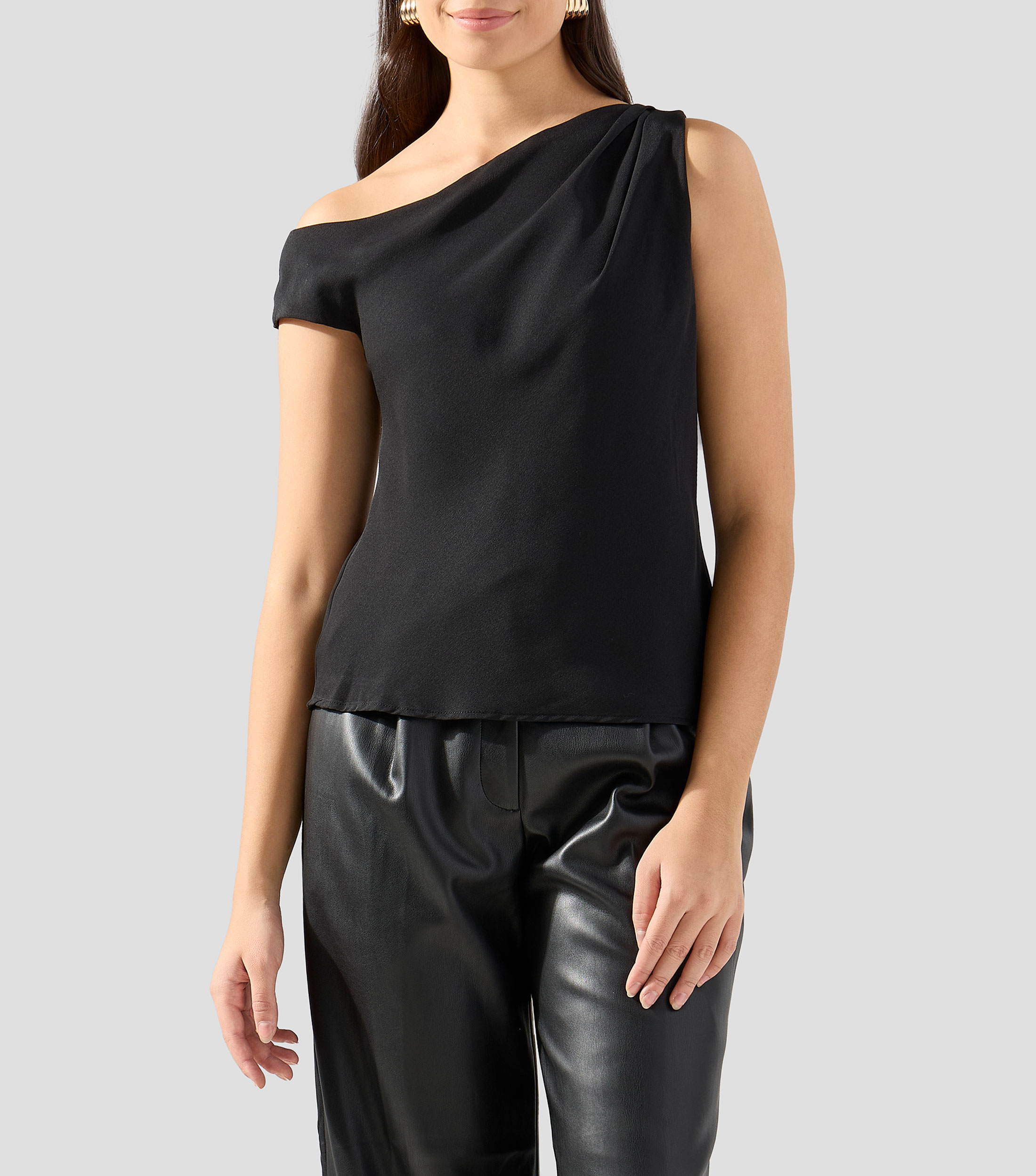 Blusa lisa sin mangas Mujer