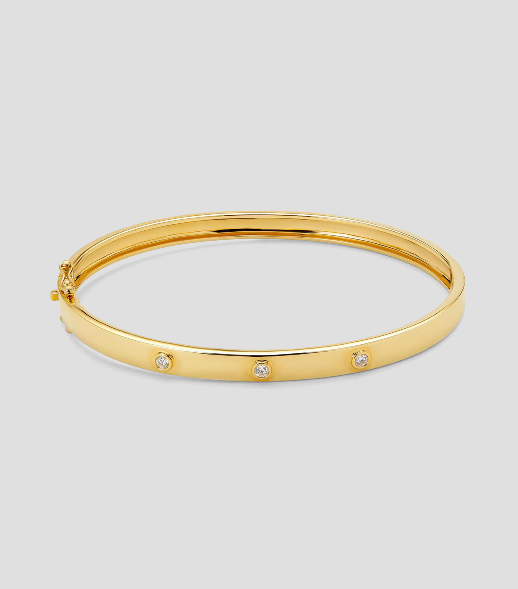 Brazalete rígido en Oro amarillo de 18 Kilates con diamantes Mujer