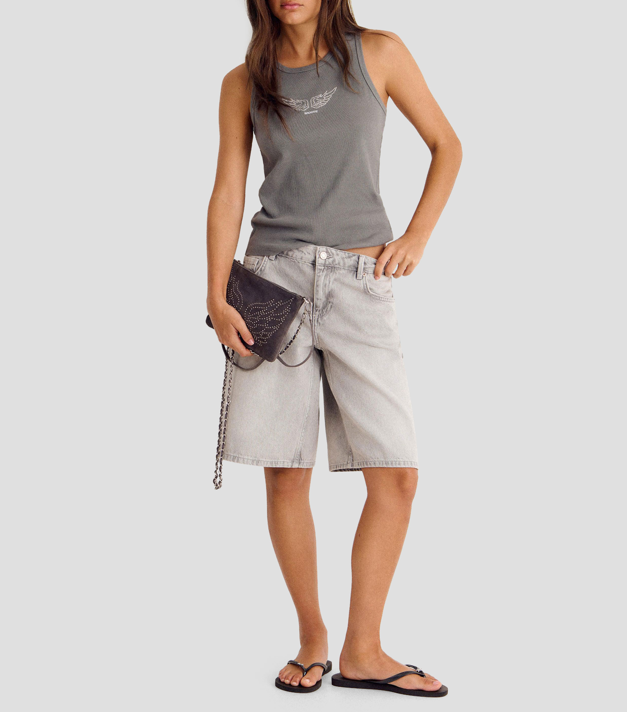 Bolsa crossbody en piel con estoperoles Mujer