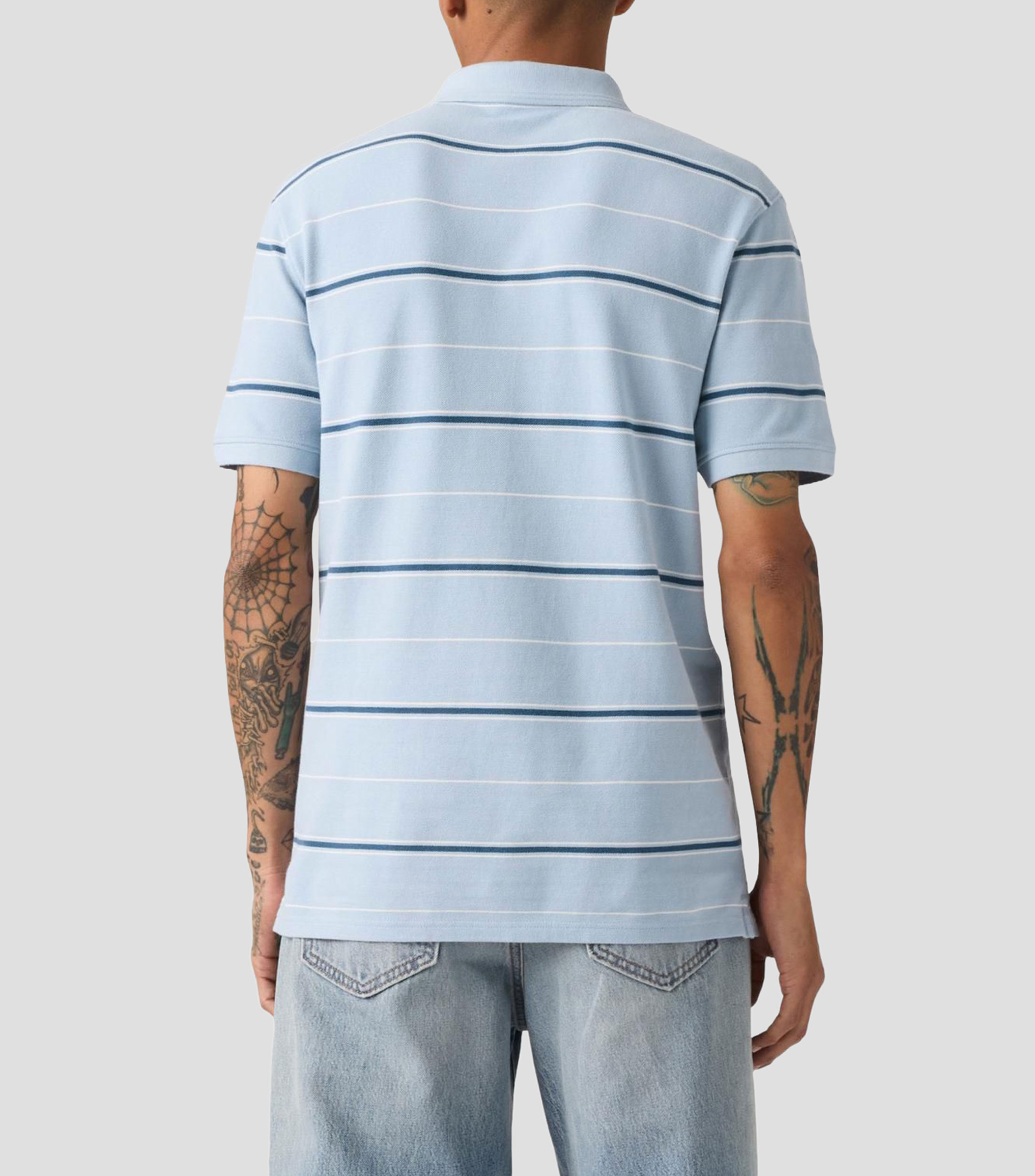 Playera tipo polo manga corta a rayas Hombre