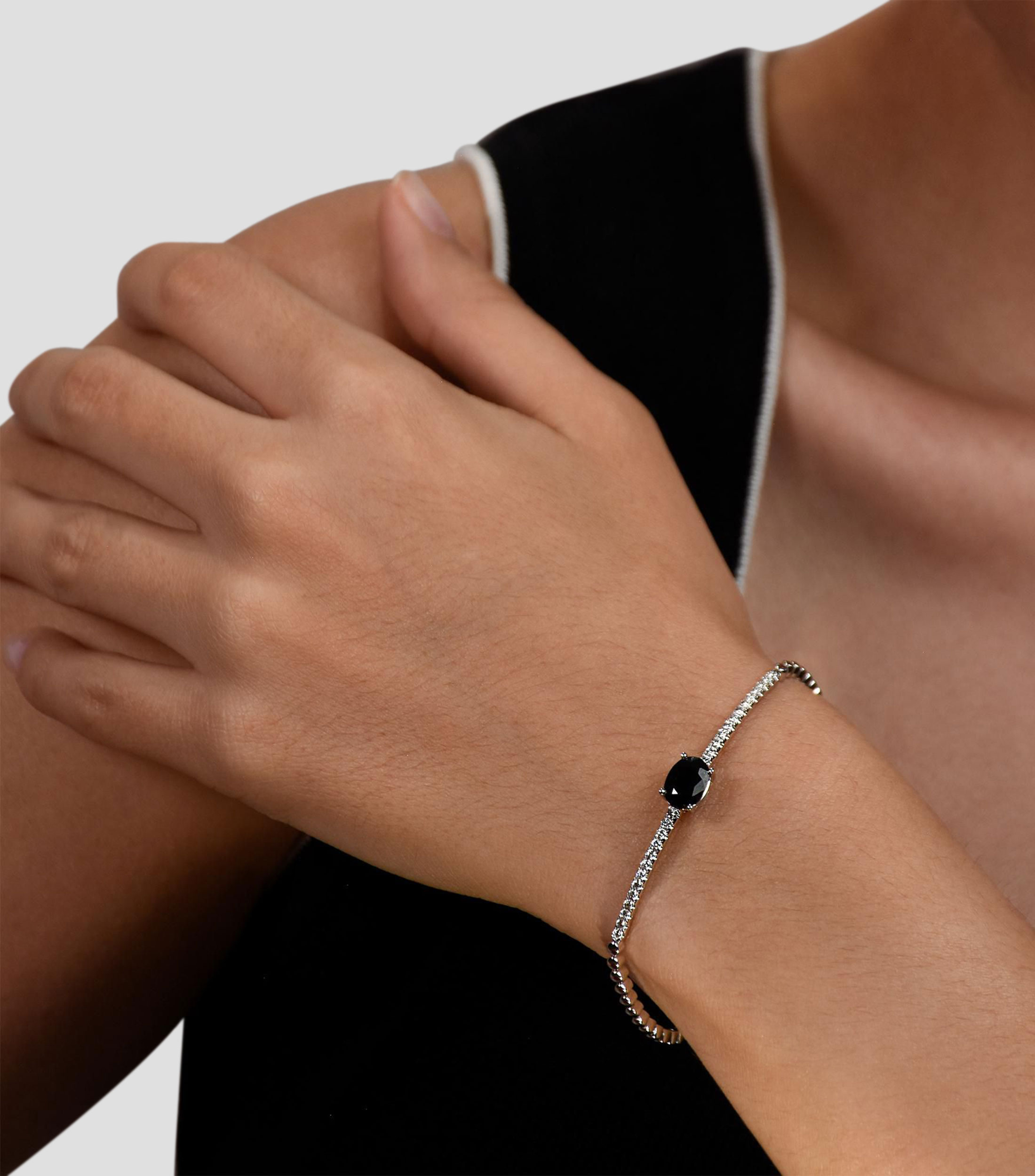 Pulsera en Oro blanco de 14 Kilates con zafiro y diamantes Mujer