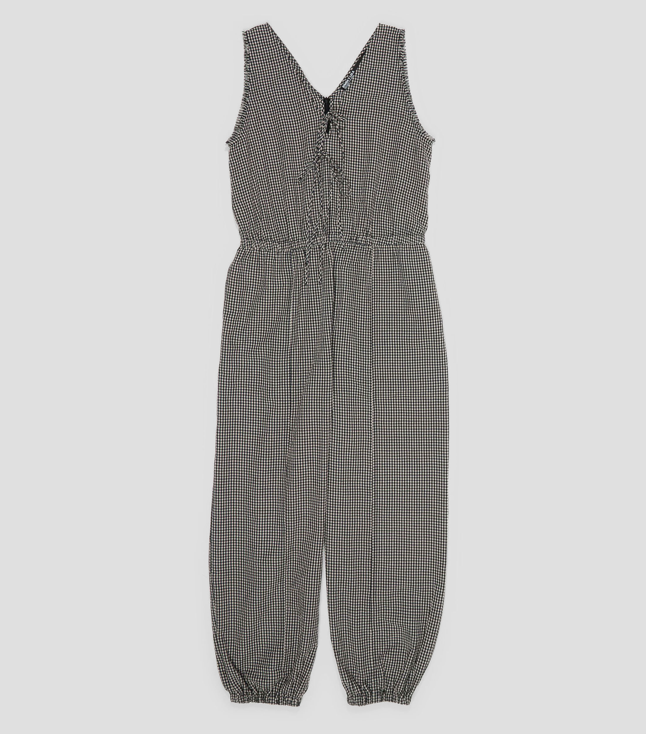 Jumpsuit bombacho lazos y desflecados Mujer