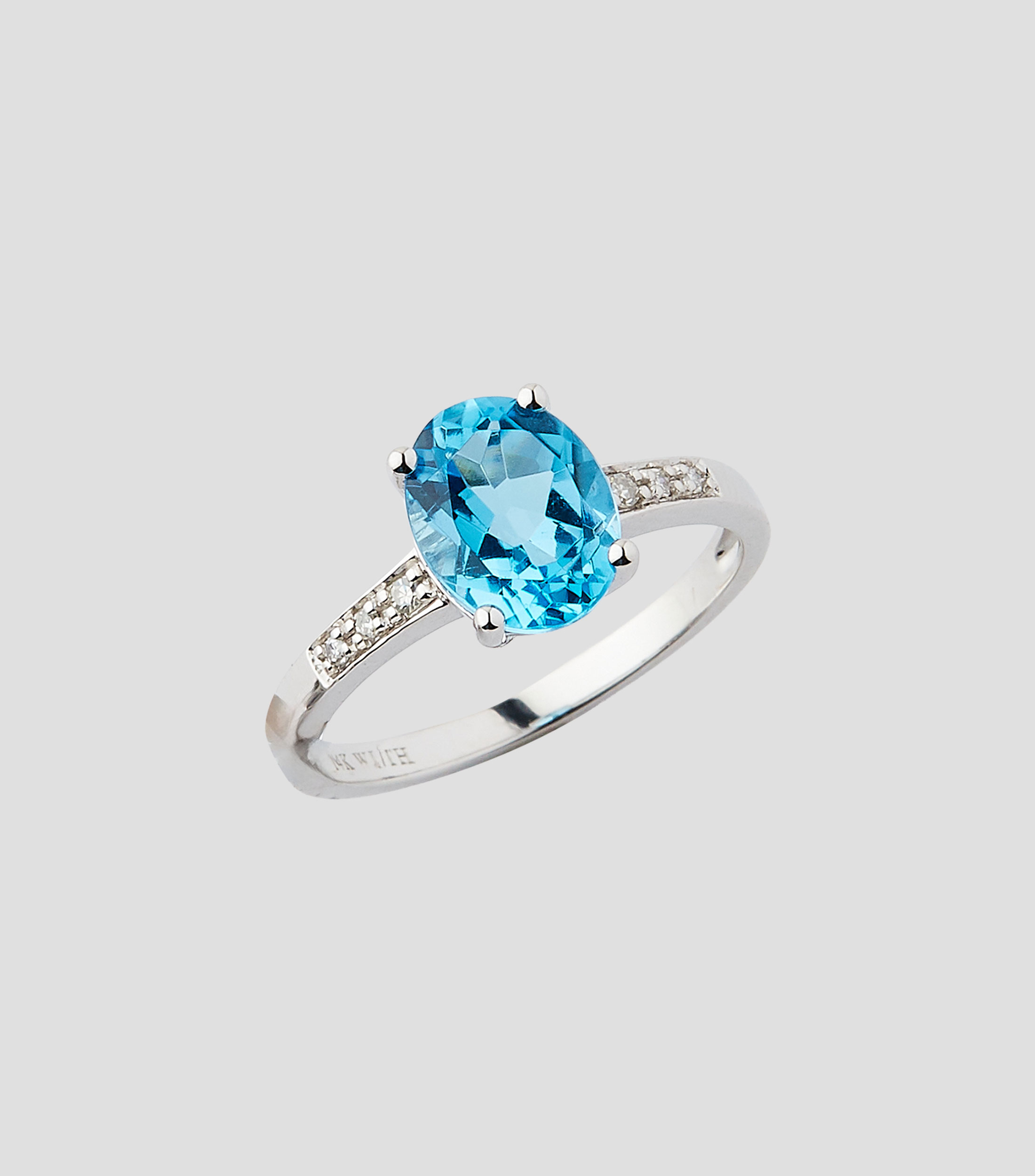 Anillo en Oro blanco de 14 Kilates con topacio Mujer