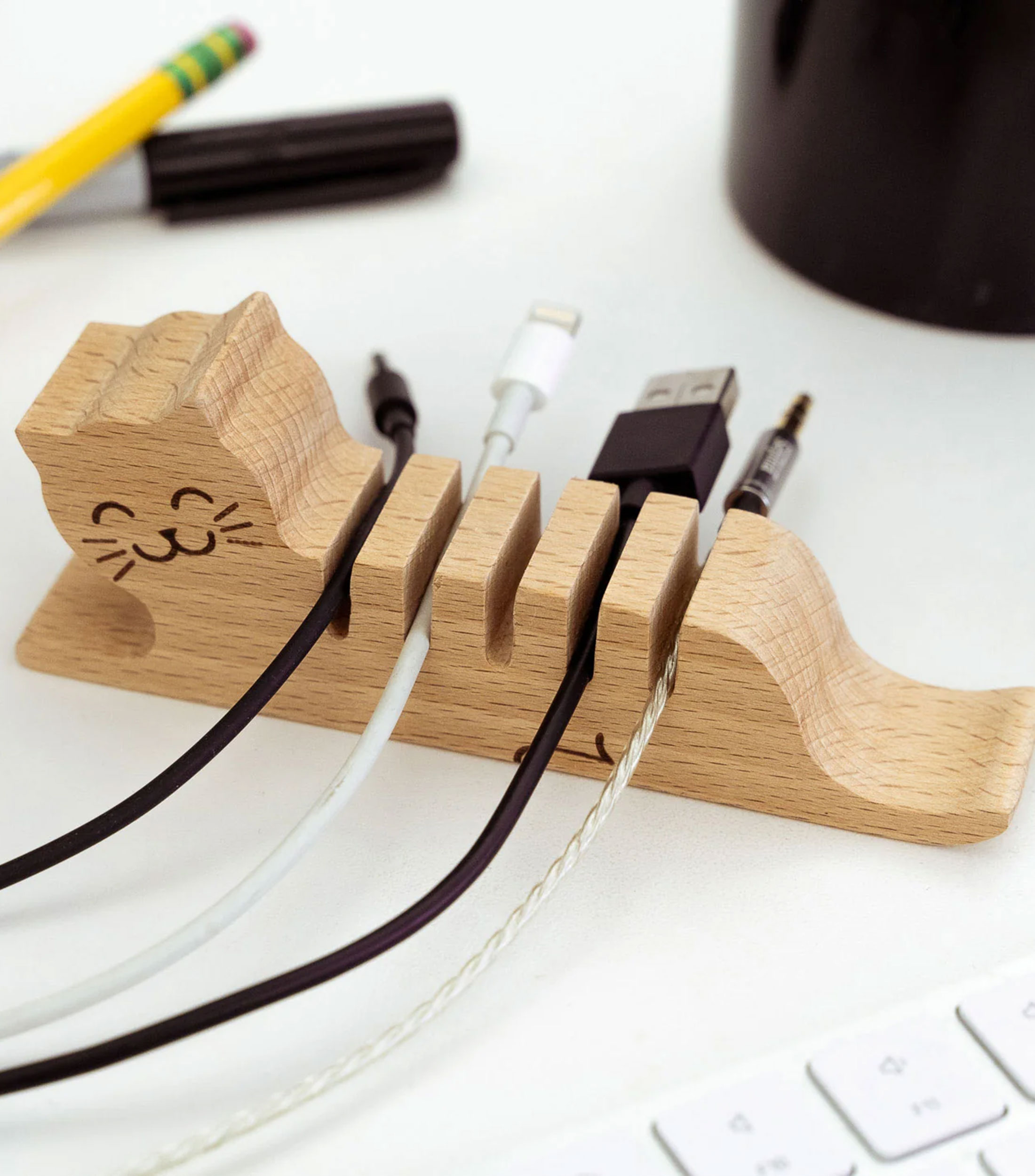 Soporte para cables en forma de gato