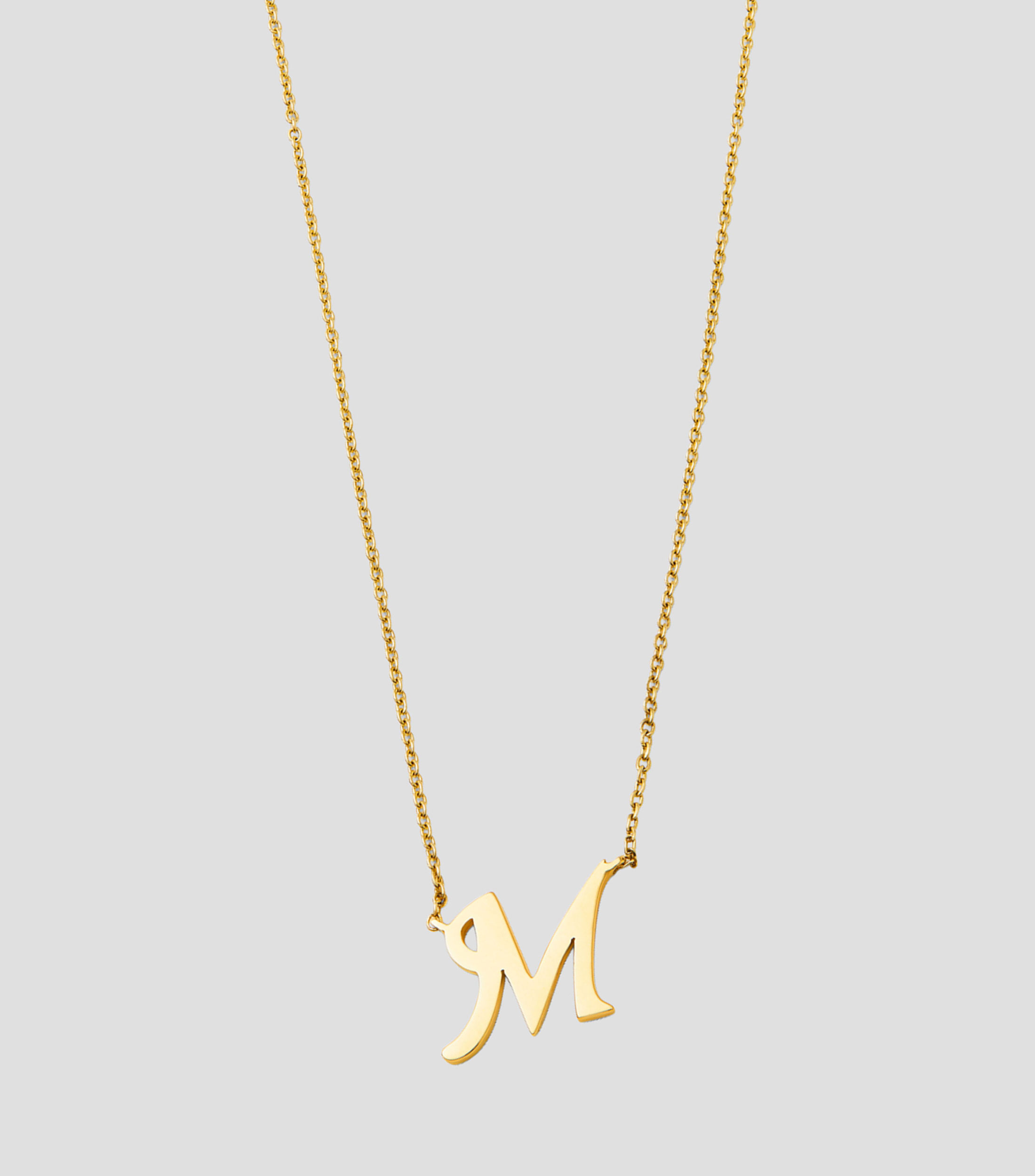 Colgante en oro amarillo de 18 Kilates letra M Mujer