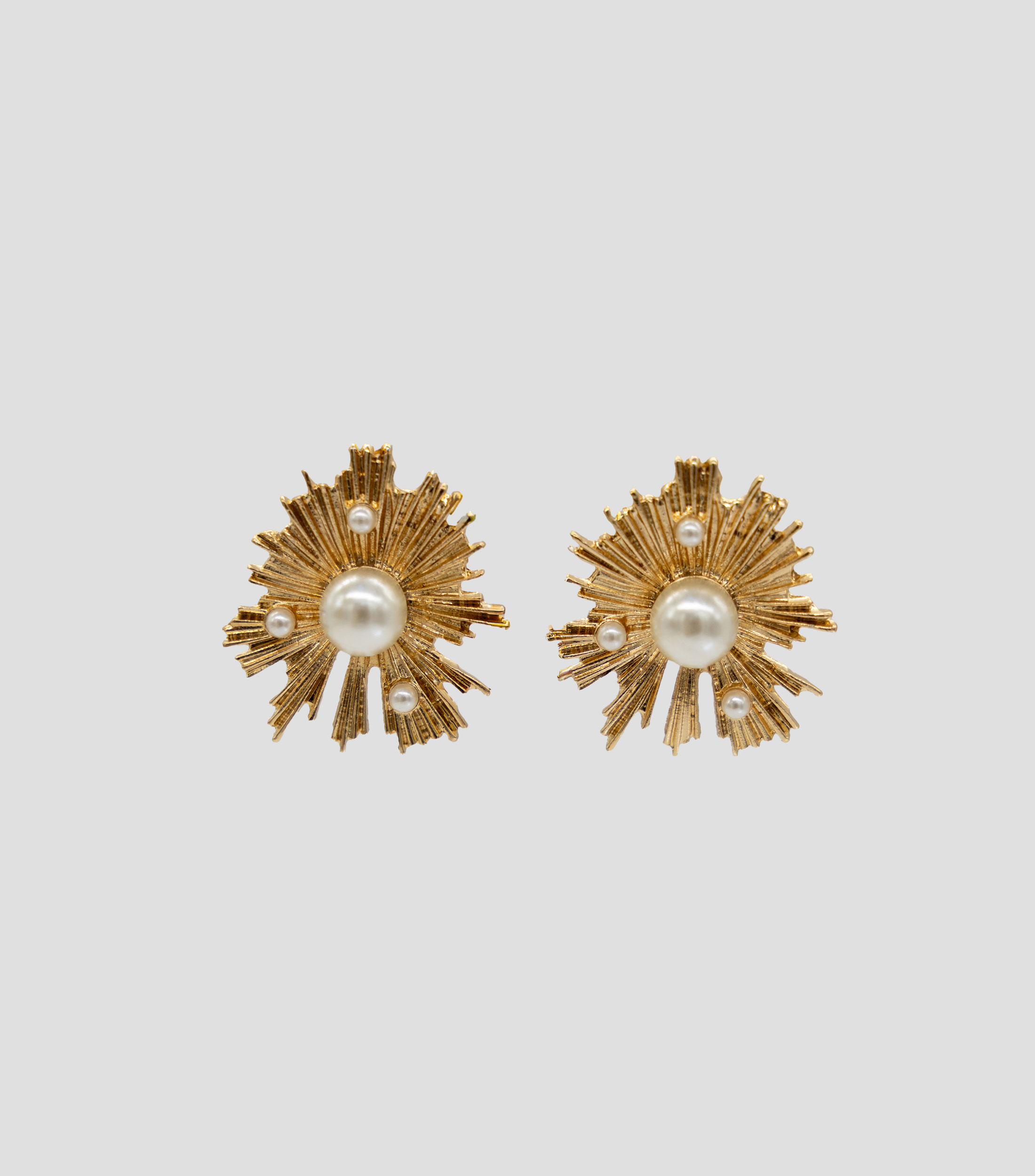 Aretes en forma de estrella con perla Mujer