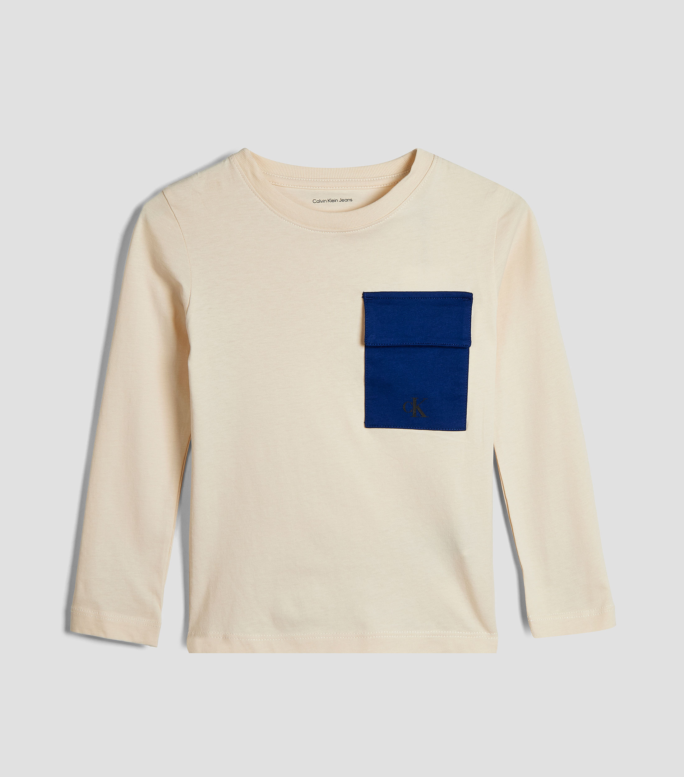 Playera cuello redondo manga larga lisa con bolsillo Niño