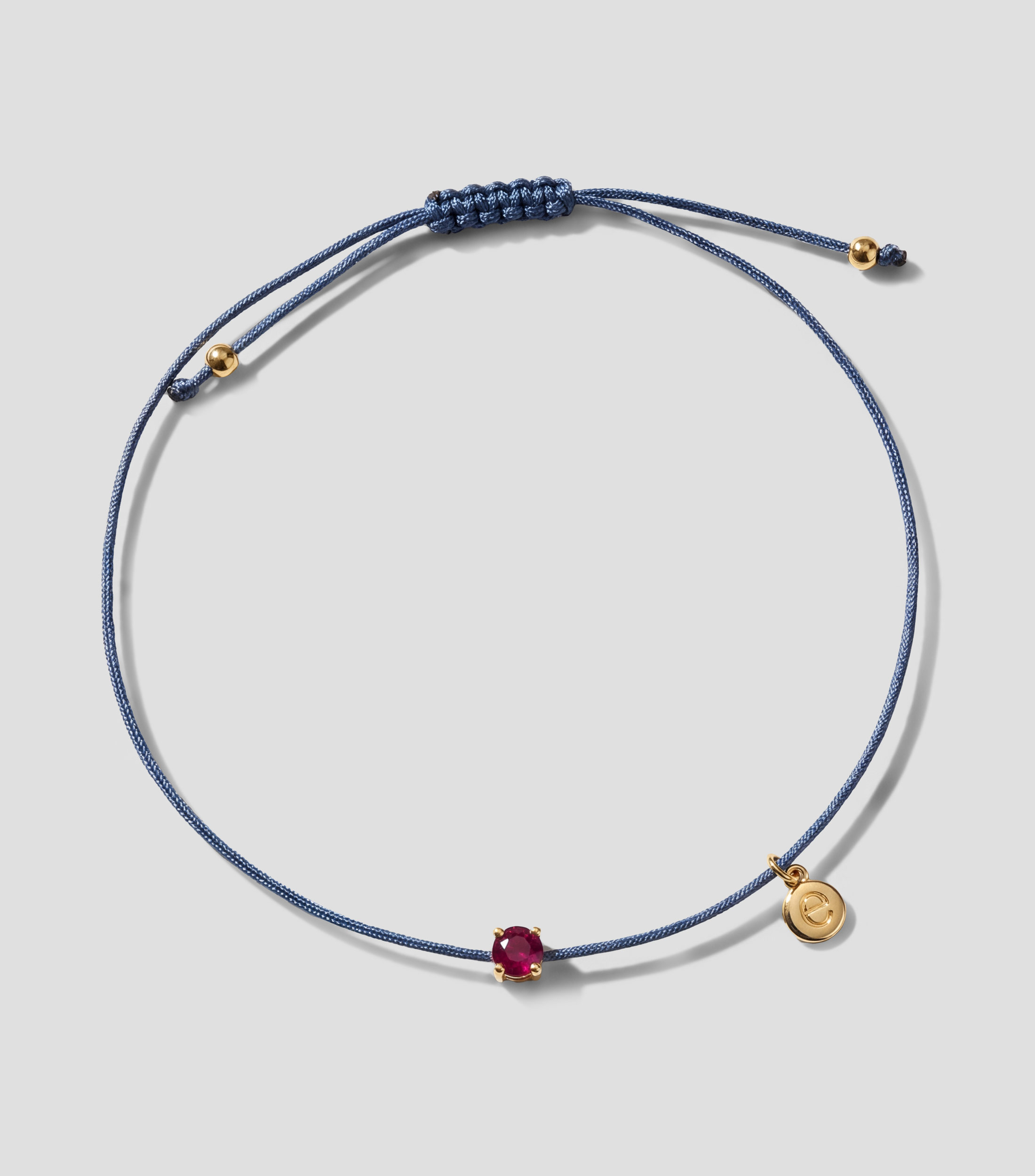Pulsera gris con colgante y rubí Mujer