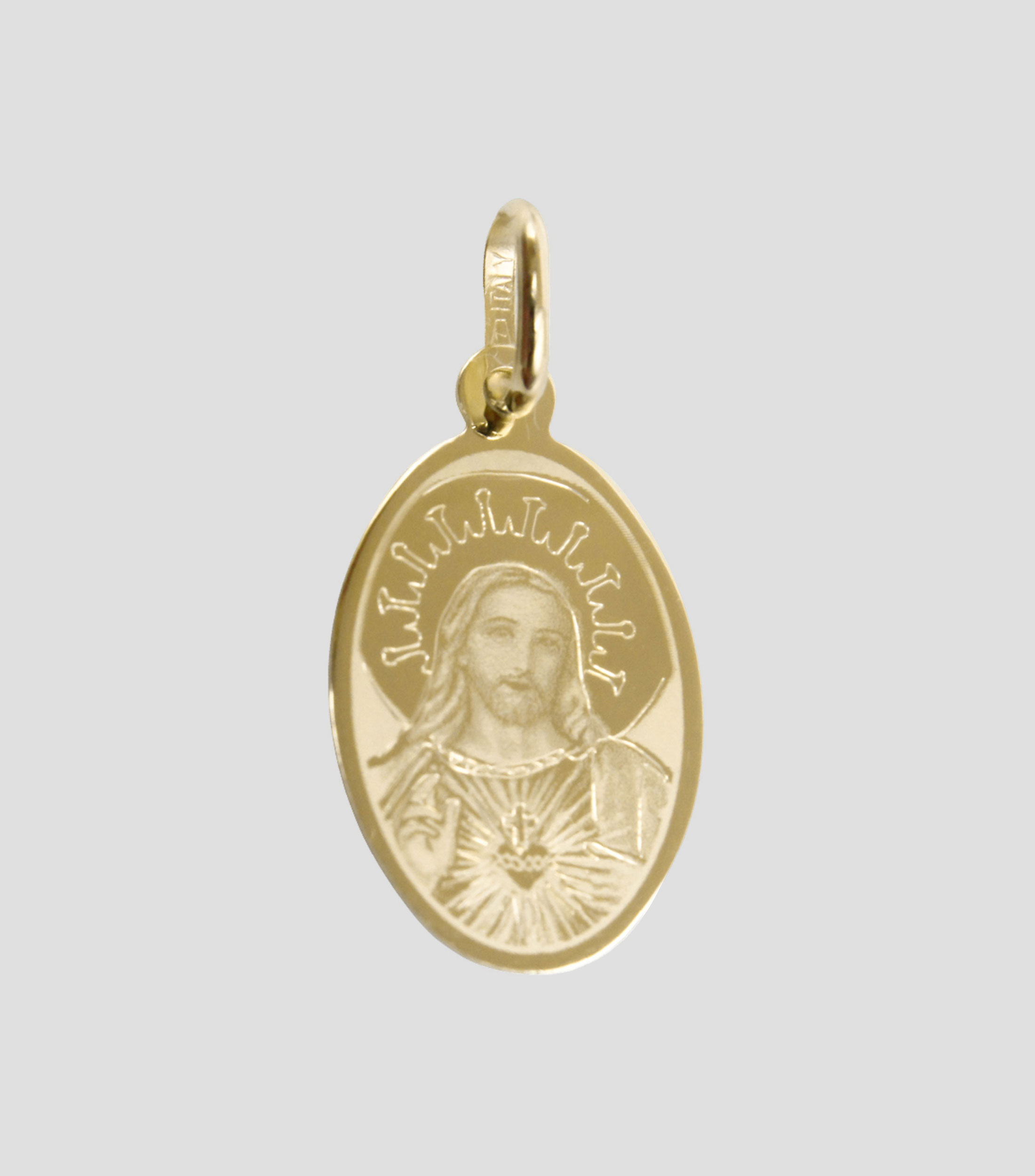 Medalla en oro amarillo 14 Kilates Sagrado Corazon Unisex