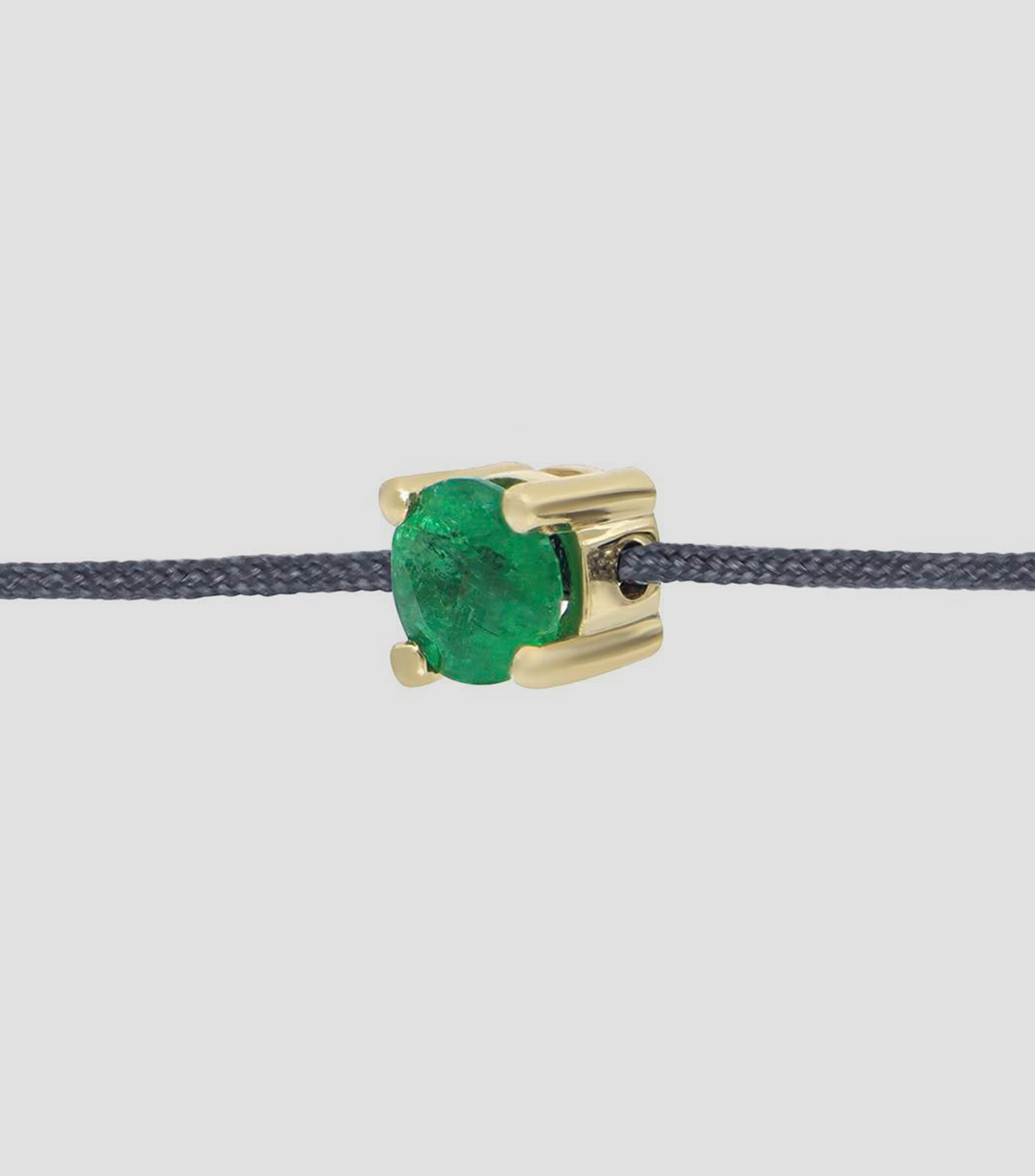 Pulsera en hilo azul pizarra con dije esmeralda Mujer