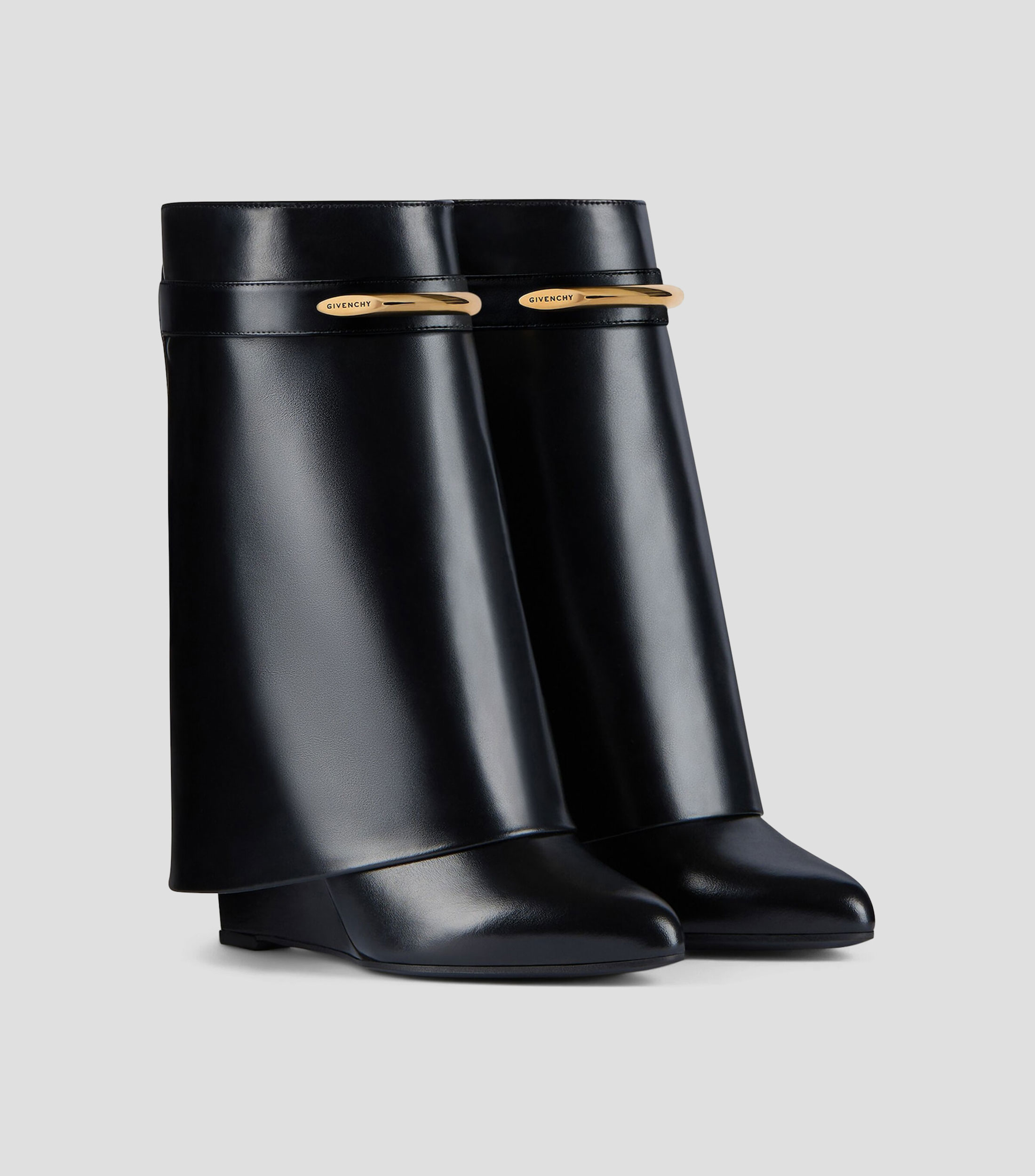 Botas cortas en piel con tacón medio de cuña Mujer