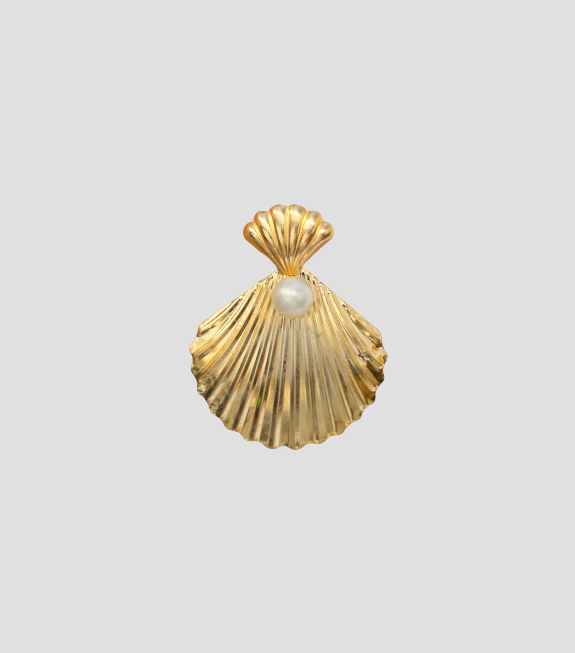 Aretes en forma de concha con perla Mujer