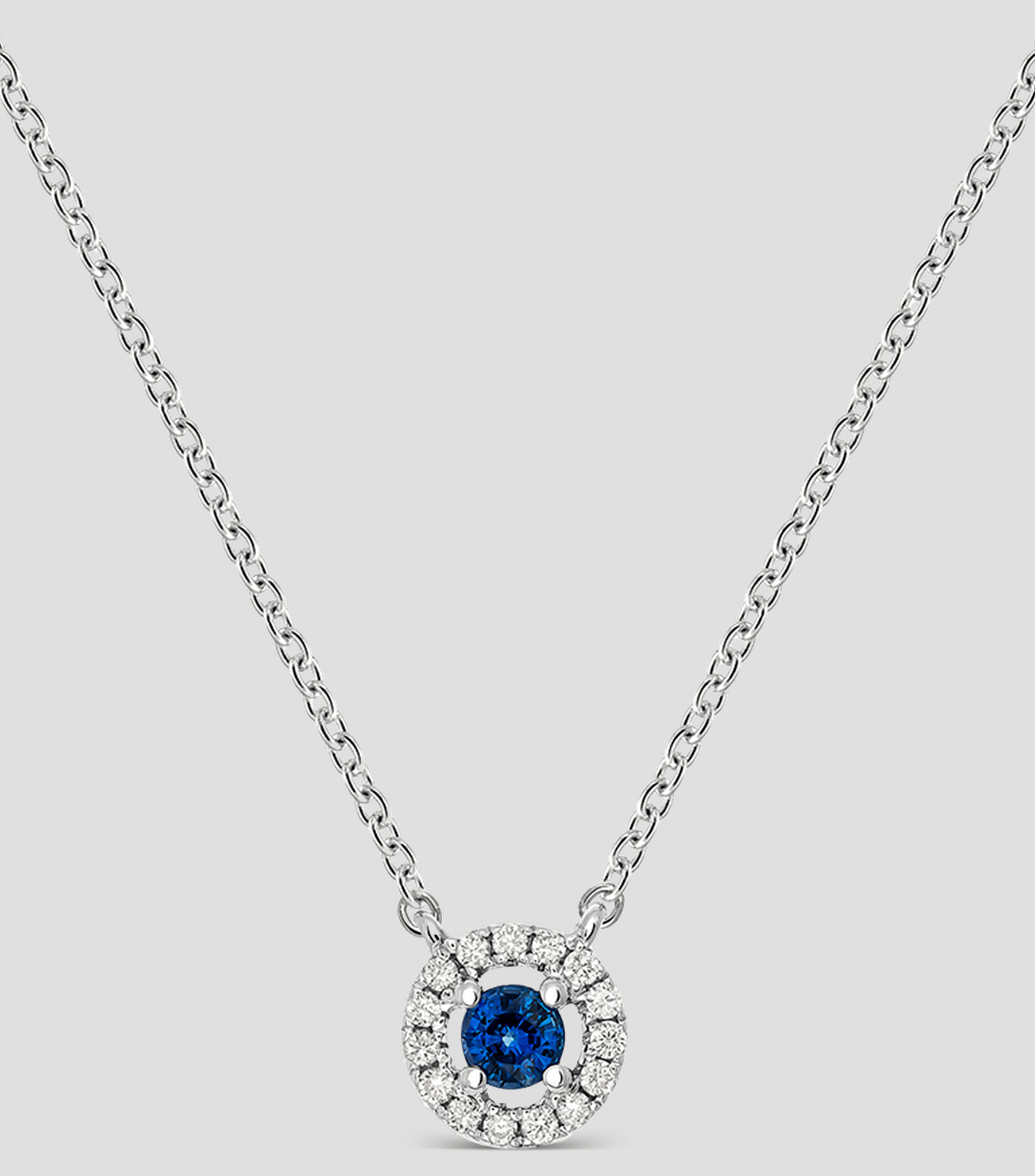 Dije con collar Big Three en oro blanco de 18 kilates con incrustacion de zafiro y diamantes Mujer
